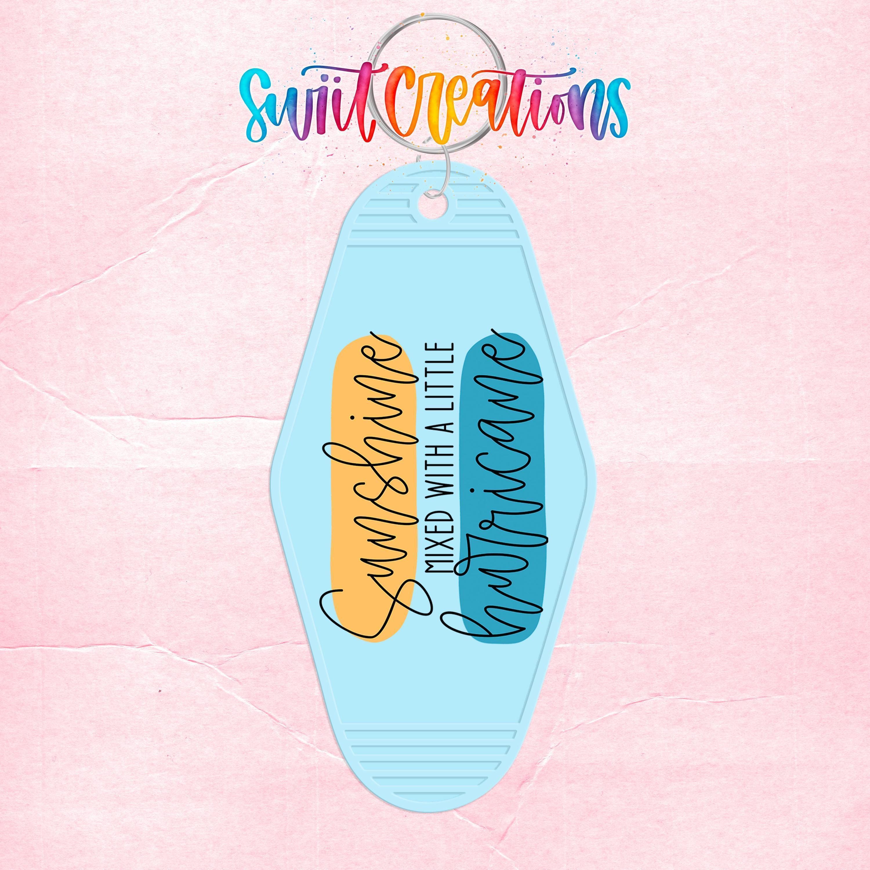 A keychain with a light blue design and text that says "Sunshine mixed with a little Hurricane".