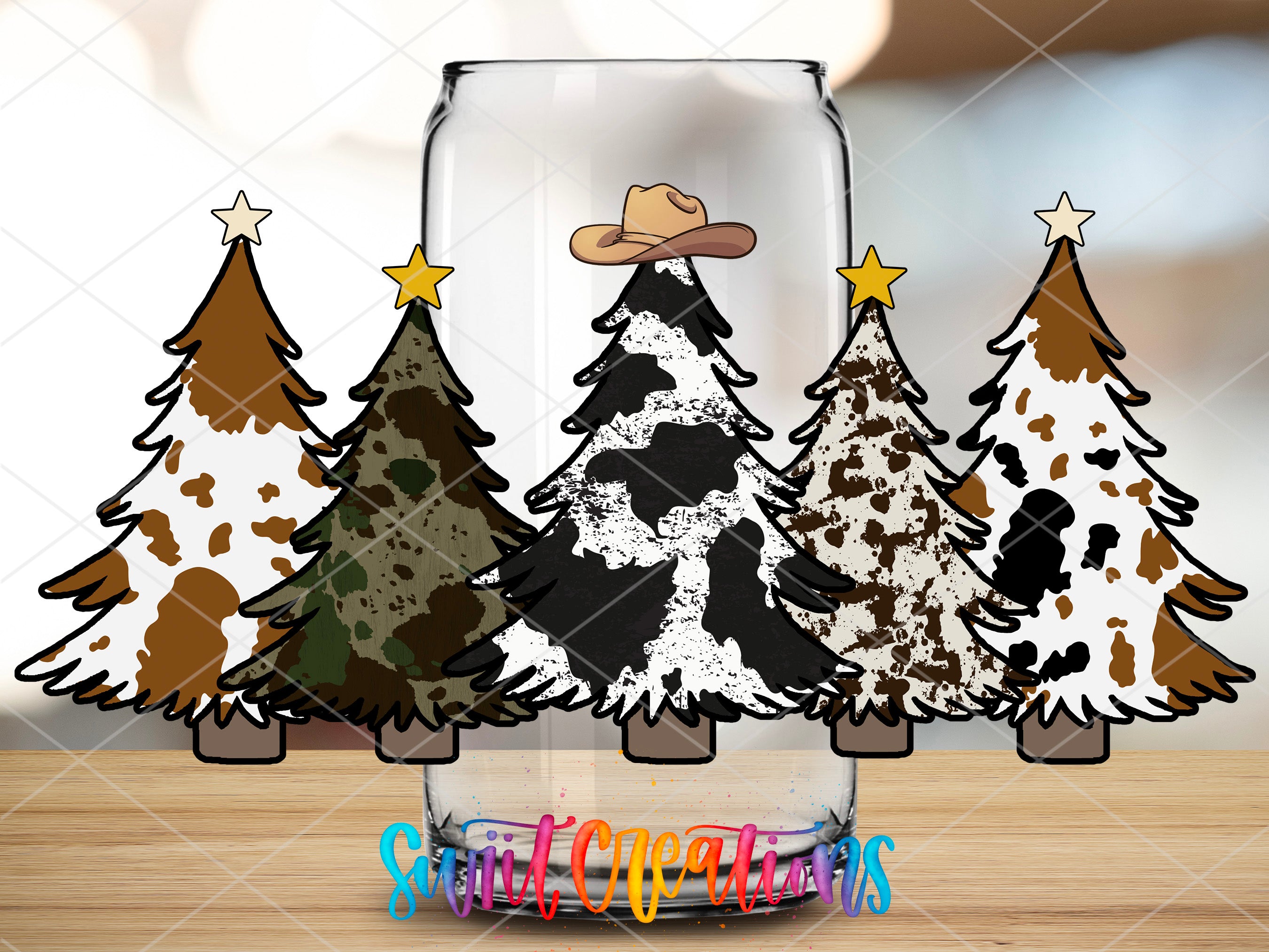 three christmas trees in a glass with a cowboy hat on top