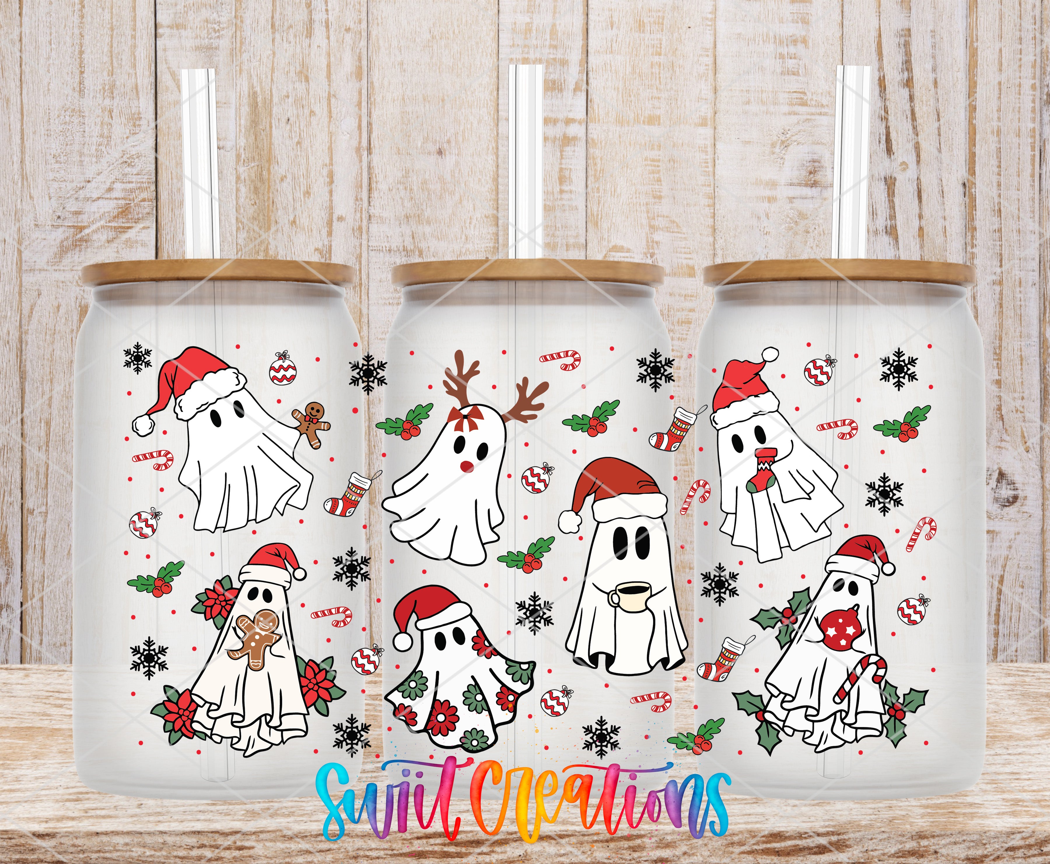 A collection of three white tumblers with black straws, each decorated with festive ghost designs and Christmas-themed elements such as snowflakes, candy canes, and pine cones.
