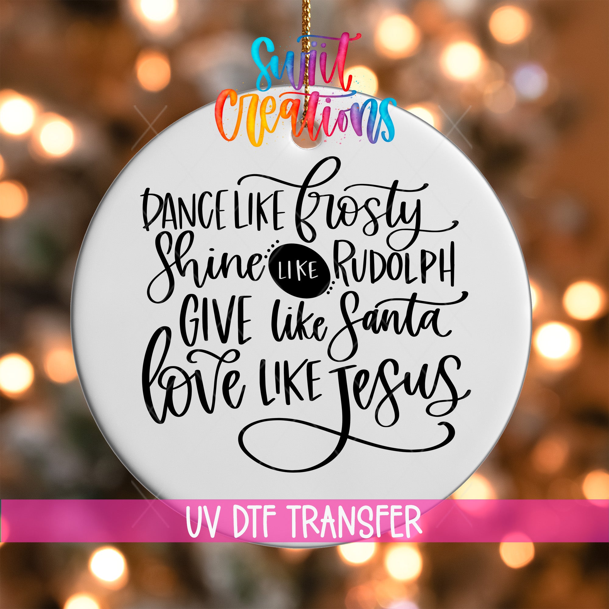 a white ornament with a message about love and joy, including phrases like "Dance like frosty", "Shine like Rudolph", "Give like Santa", and "Love like Jesus".