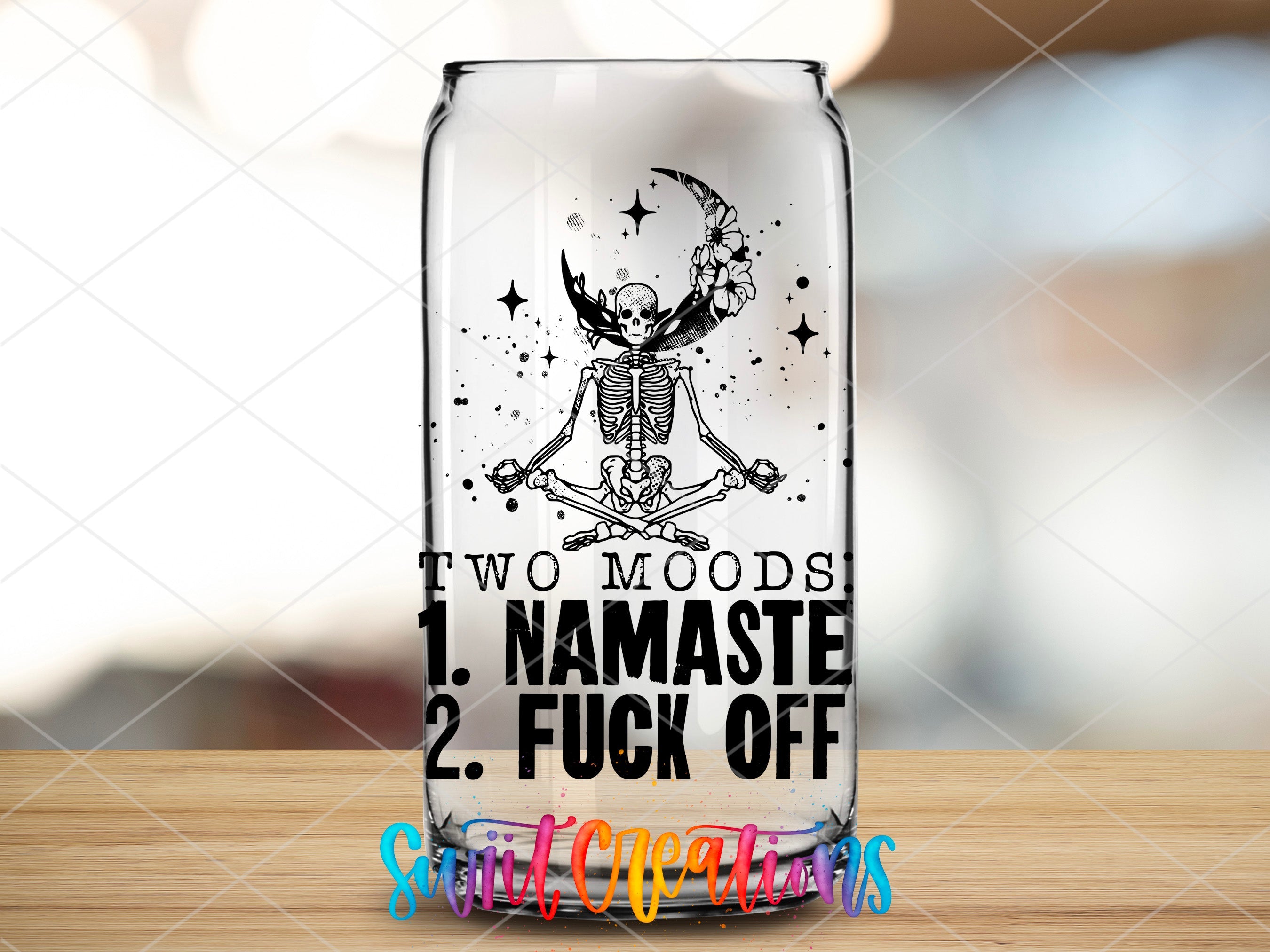 a glass with a picture of a skeleton on it