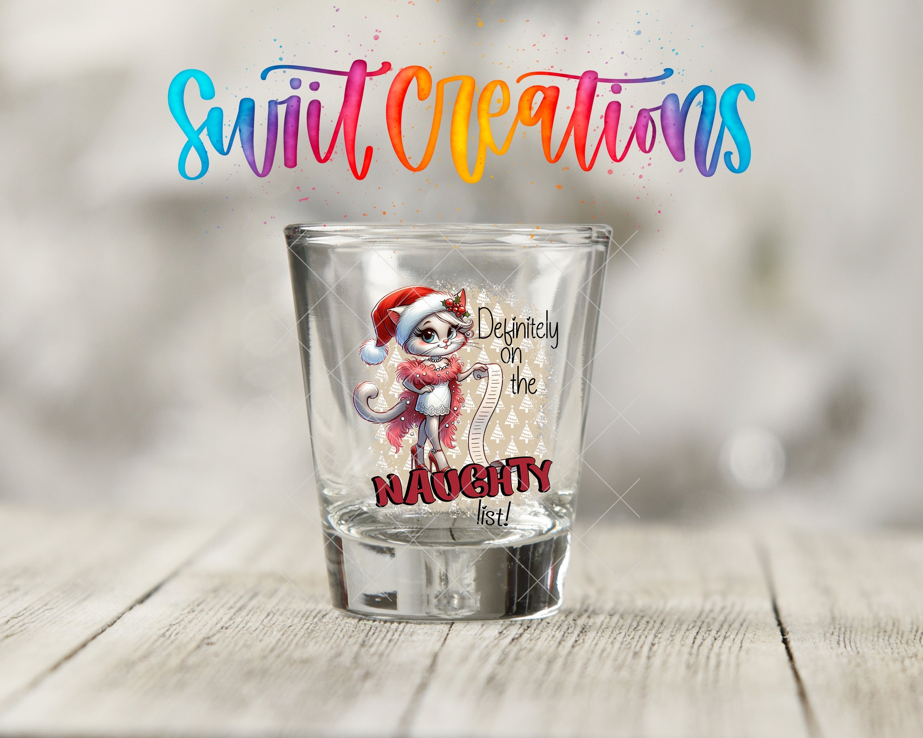 a shot glass with a picture of a santa clause on it