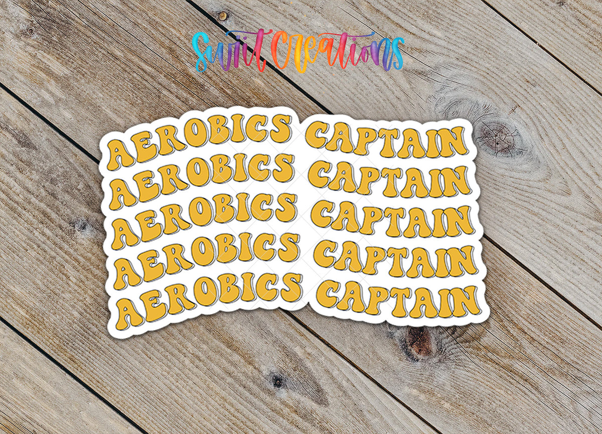 Stickers with the word "CAPTAIN" repeated in a playful, artistic font on a wooden background.