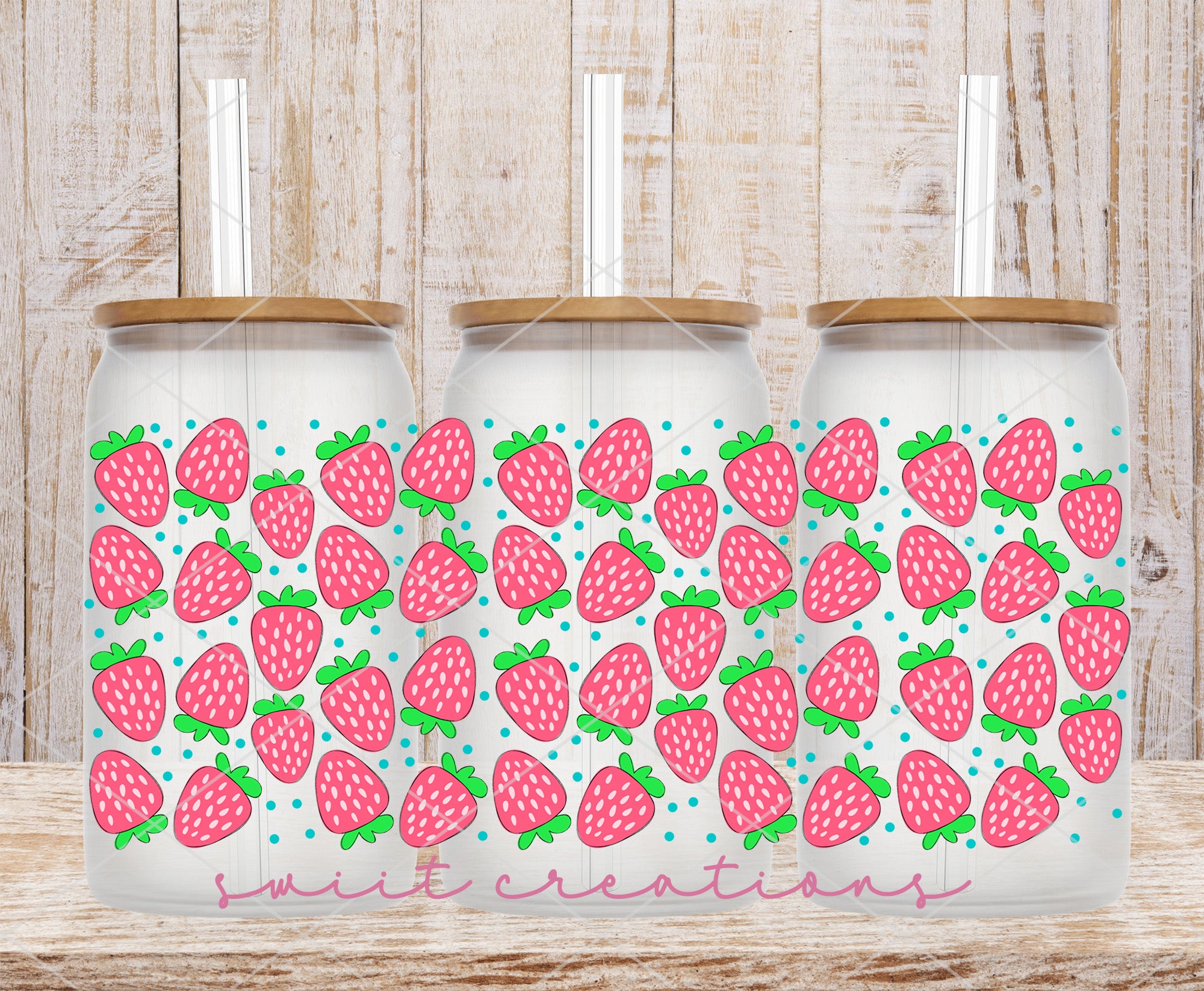 a couple of water bottles with strawberries on them