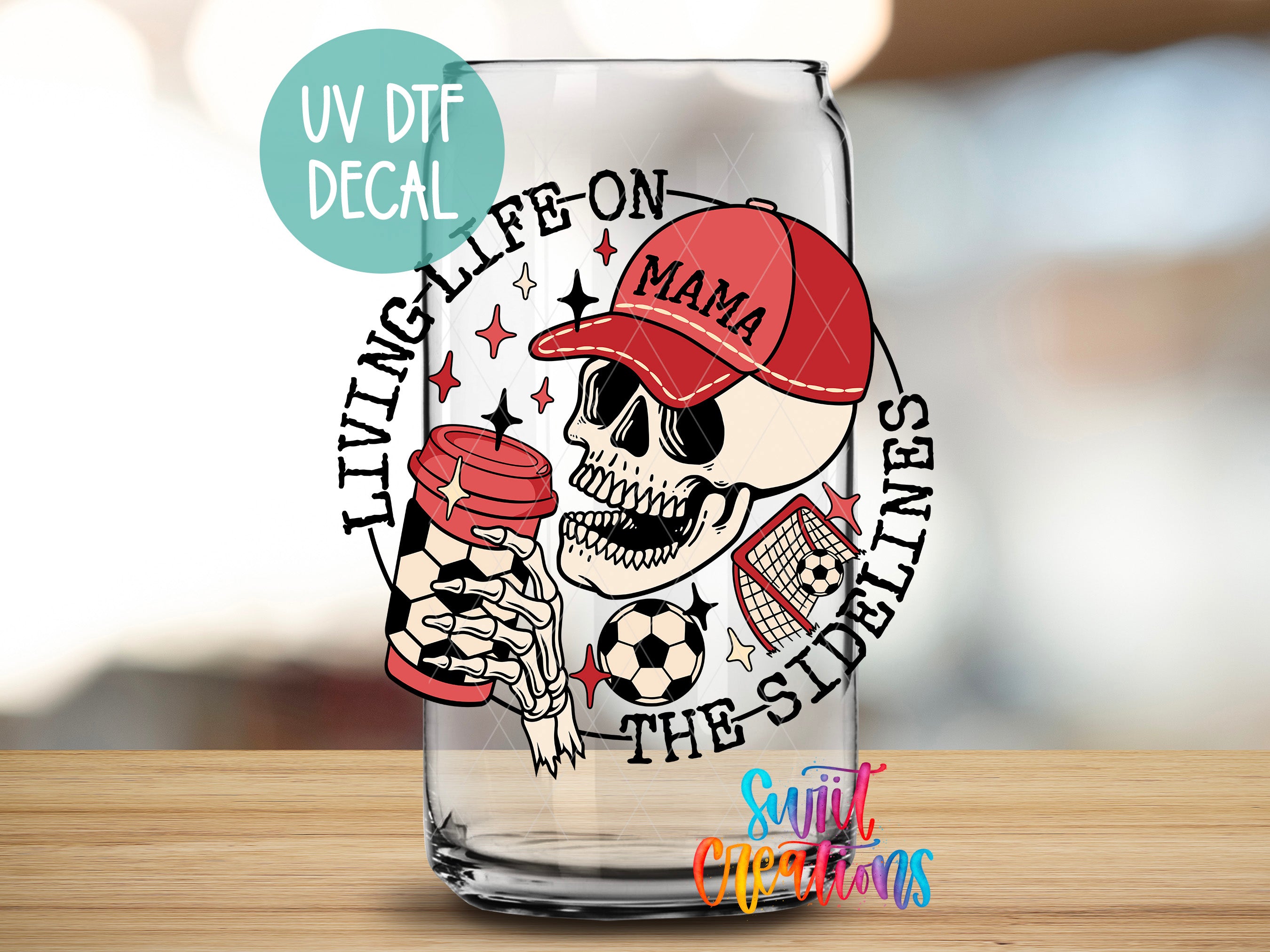 a glass with a skull holding a soccer ball