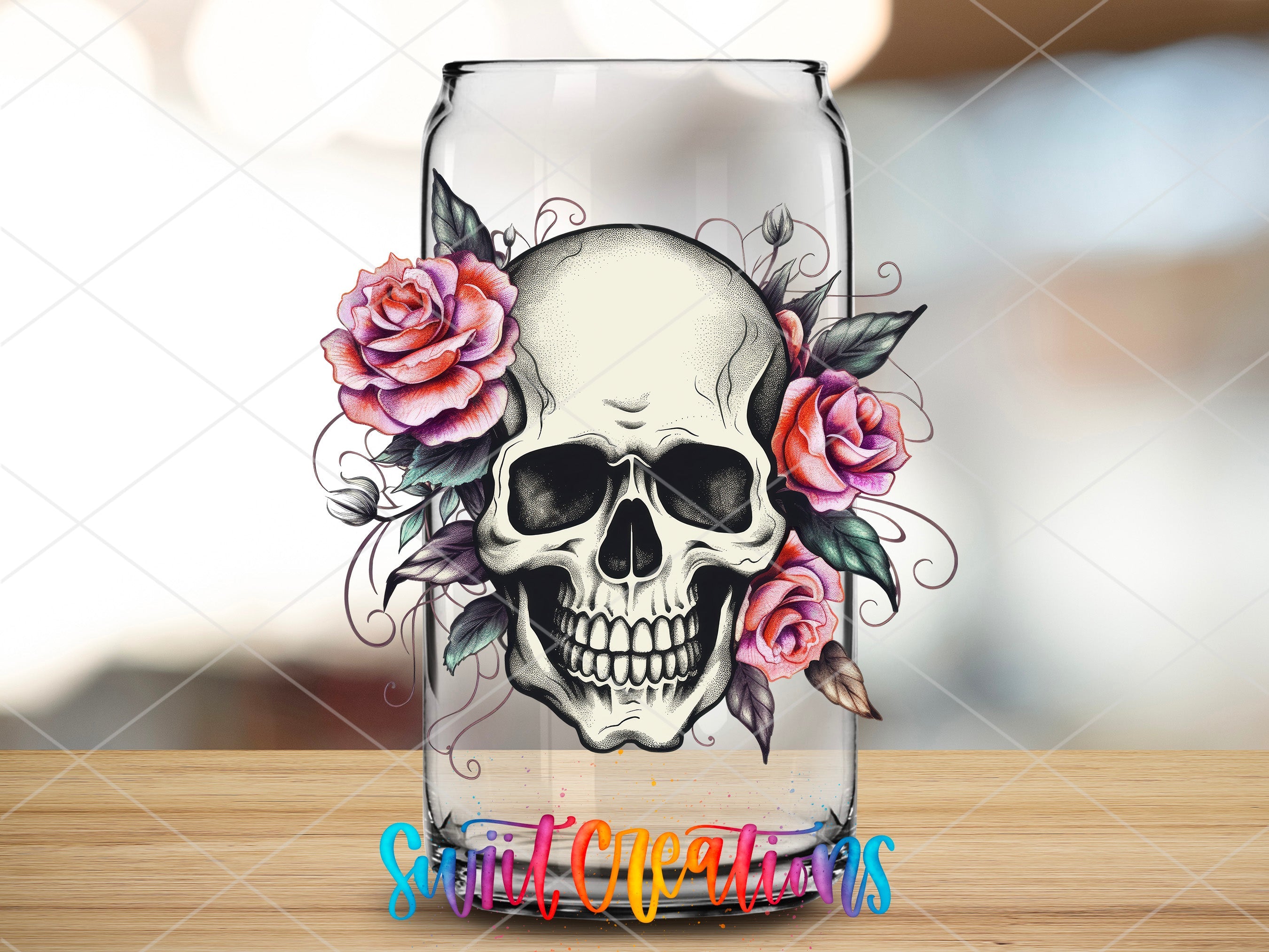 a glass with a skull and roses on it