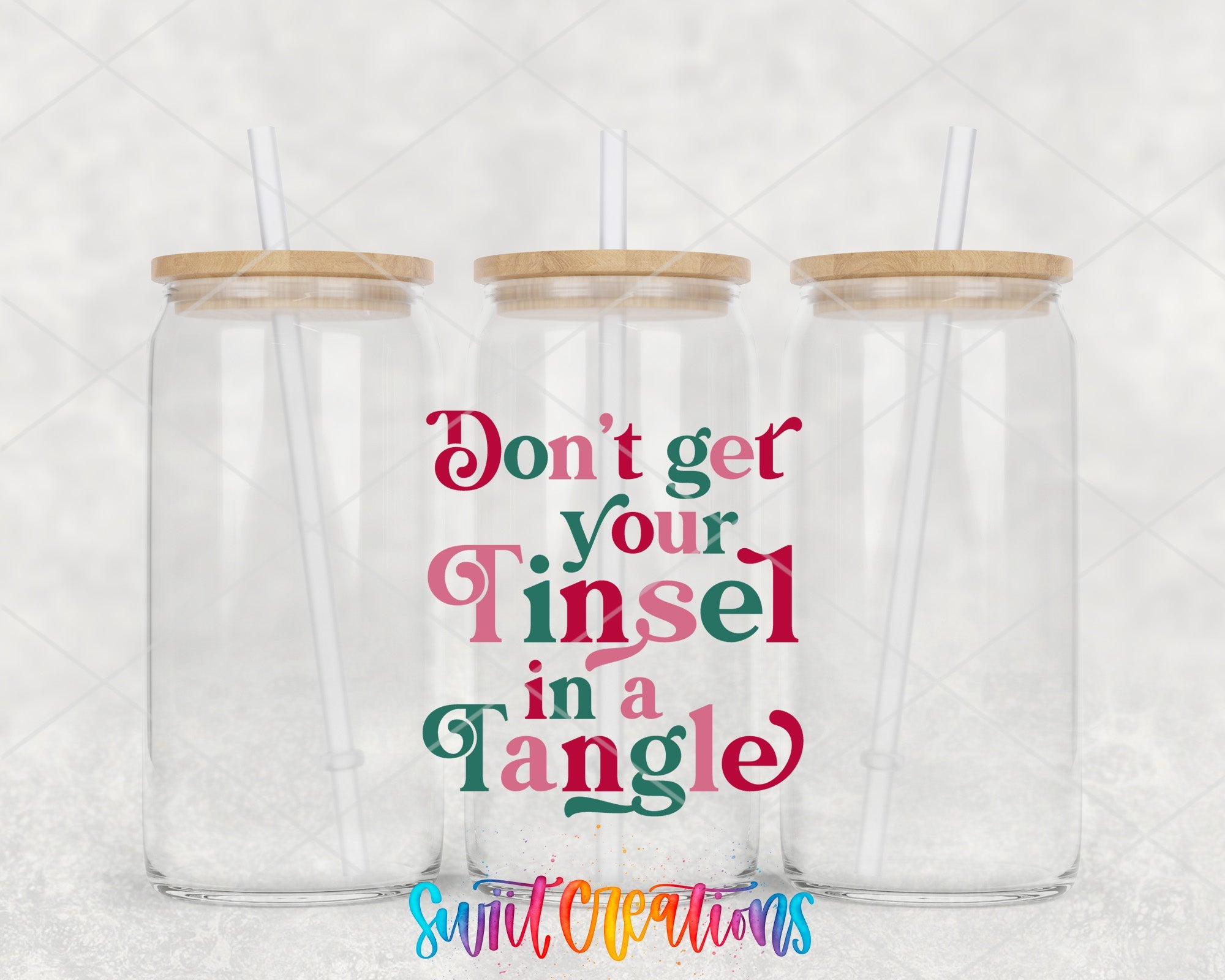 two tumblers with straw tops that say don't get your tinsel in
