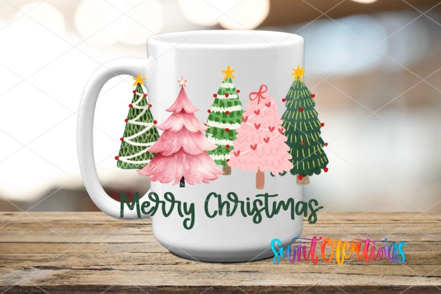 a white coffee mug with christmas trees on it