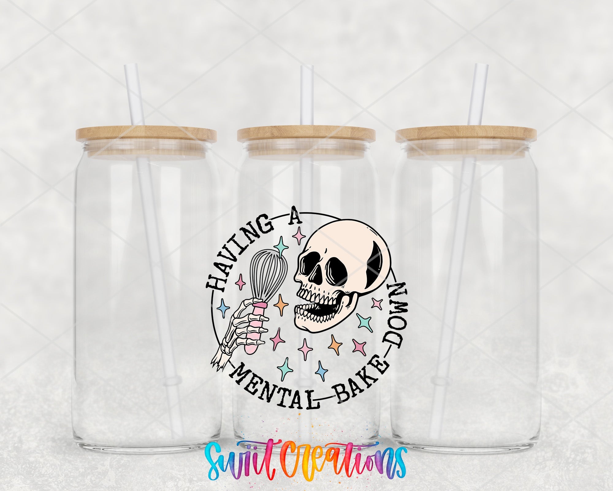 two clear tumblers with a skeleton holding a whisk