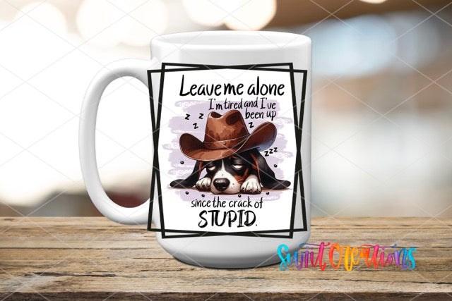 a coffee mug with a picture of a dog wearing a cowboy hat