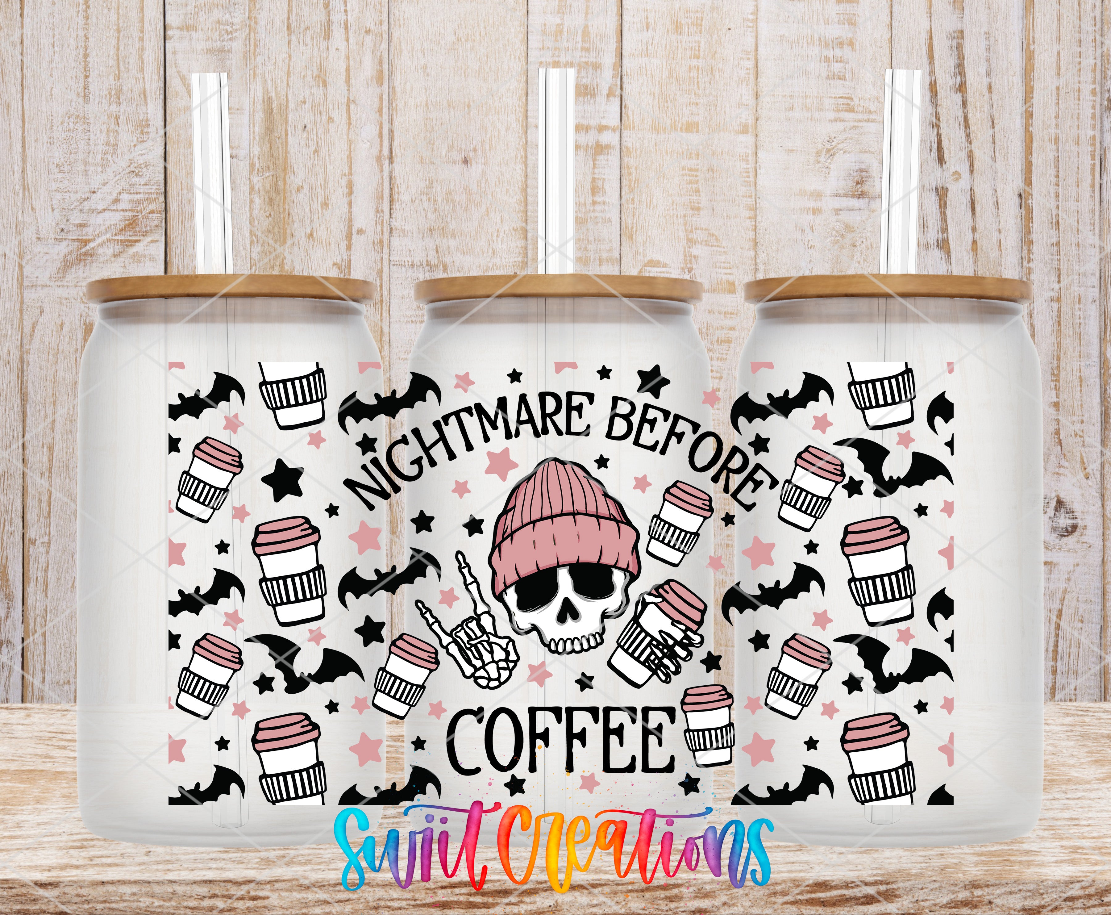 three white coffee canisters with black and pink designs, including skulls, bats, and coffee cups. The text on the canisters reads "NIGHTMARE BEFORE COFFEE".