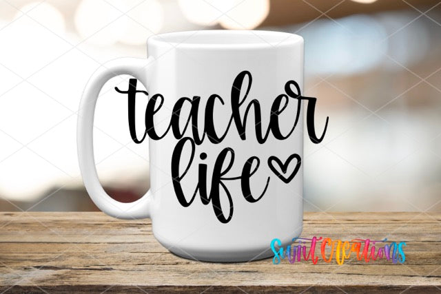 a white coffee mug with the words teacher life on it
