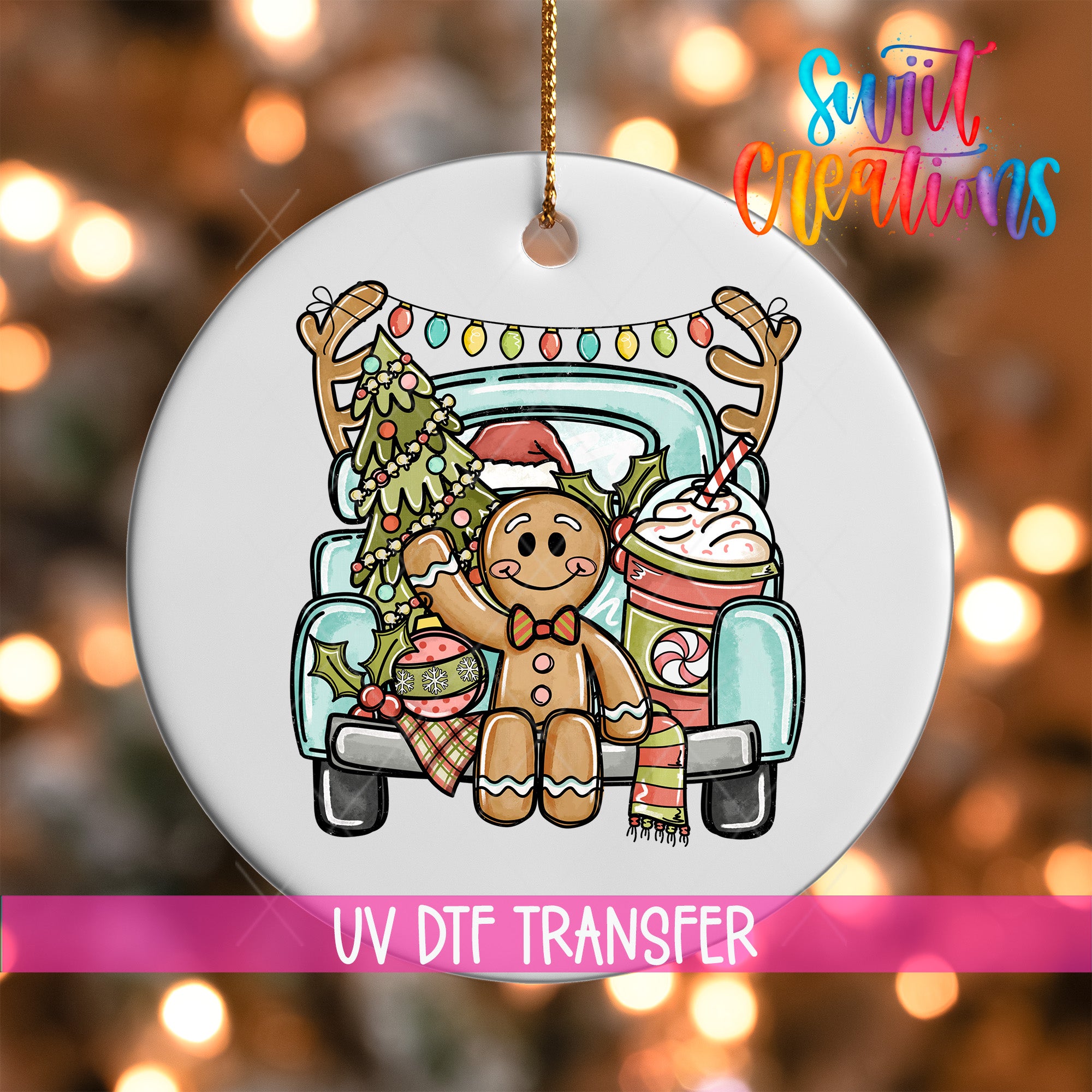 A white ornament with a gingerbread man and Christmas decorations, including a Christmas tree, hanging from a string.