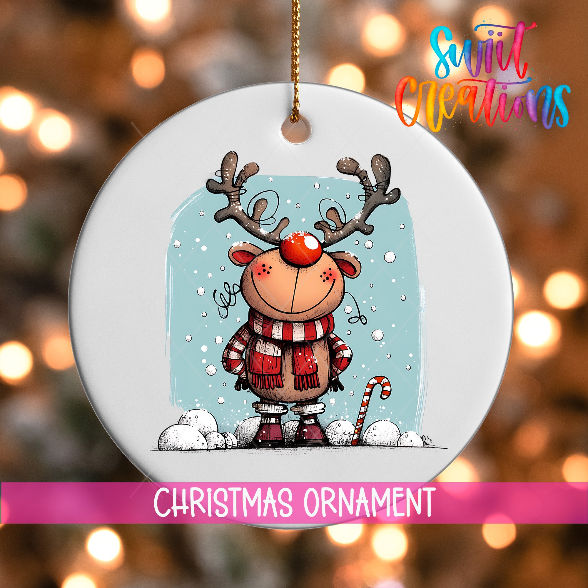 A white Christmas ornament featuring a cartoon reindeer with antlers and a red nose, standing on a snowy landscape with a snowflake pattern.
