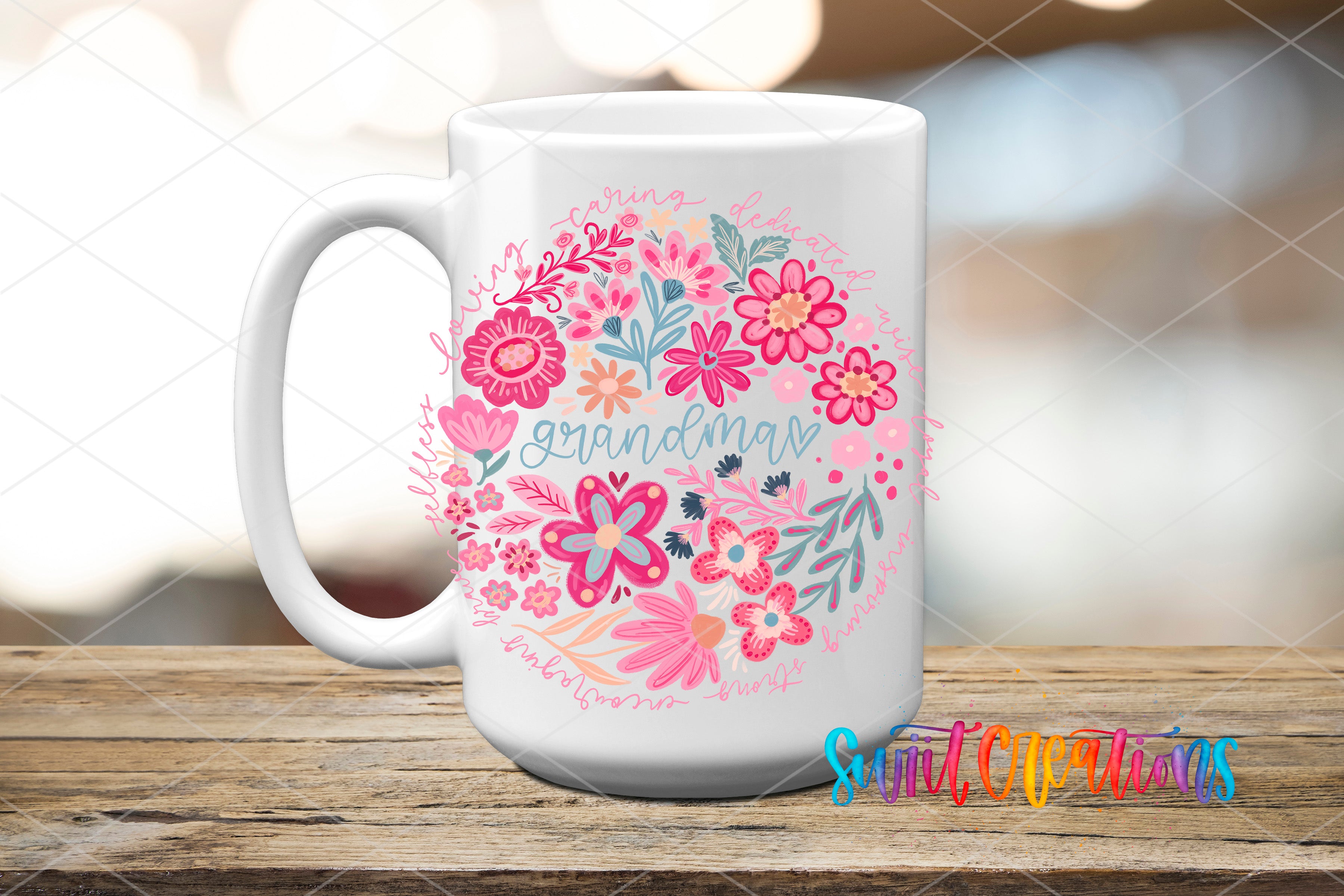 A white ceramic mug with a floral design and the word "Grandma" printed on it, placed on a wooden surface.