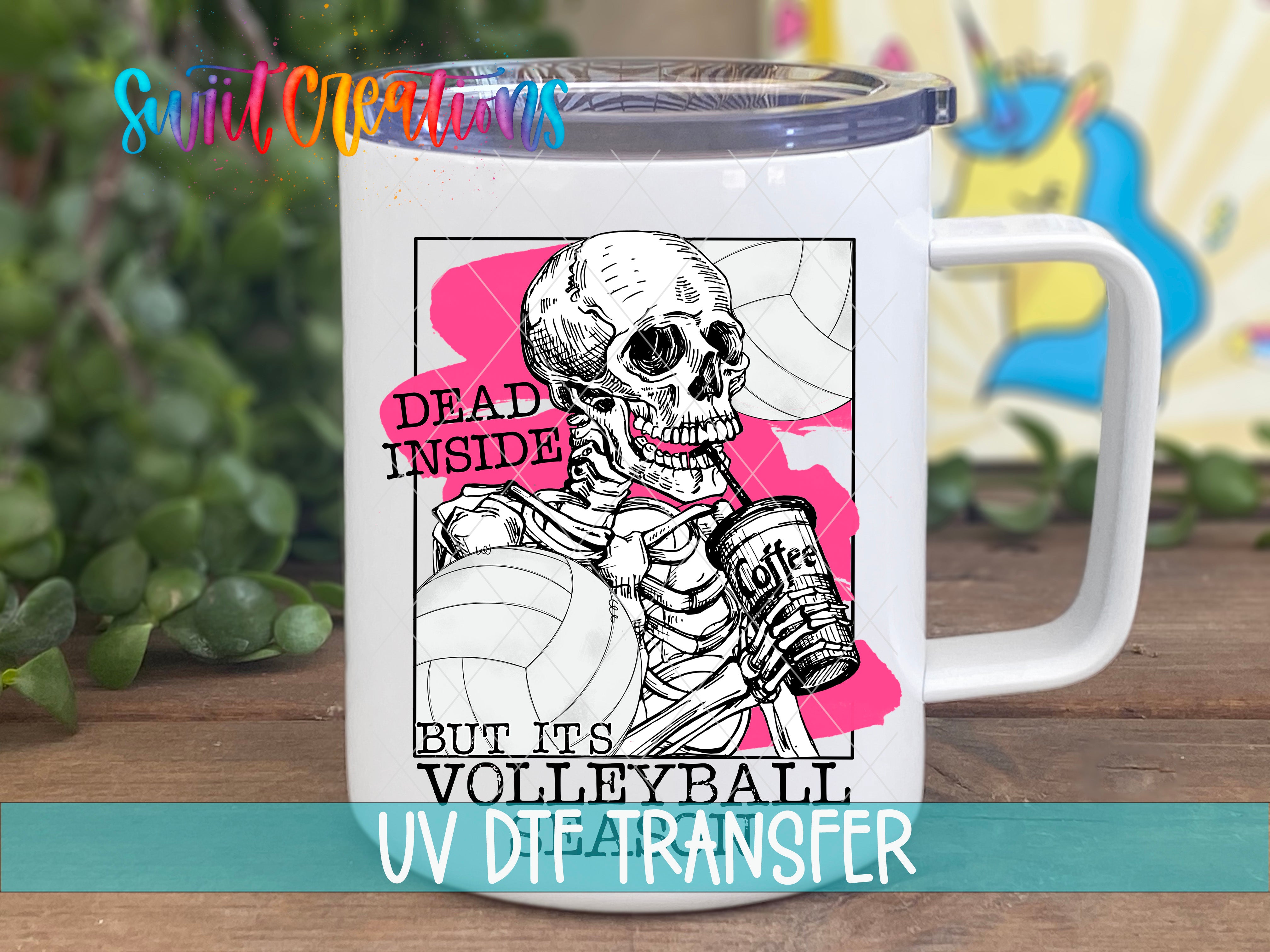 A white mug with a graphic design featuring a skeleton holding a volleyball and the text "Dead inside but it's volleyball" printed on it.