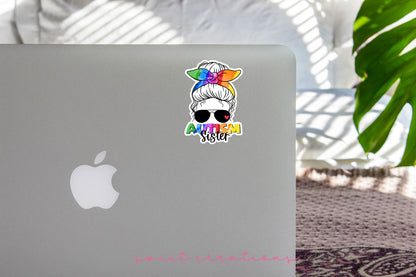 Autism Sister sticker on the lid of a silver laptop