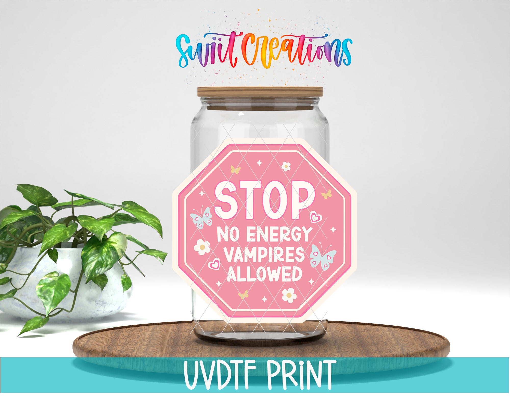 a glass jar with a pink stop sign sticker on it, placed on a wooden surface. The sticker has the text "STOP NO ENERGY VAMPIRE ALLOWED" printed on it. There is also text at the bottom of the image that says "UVDDF PRINT".