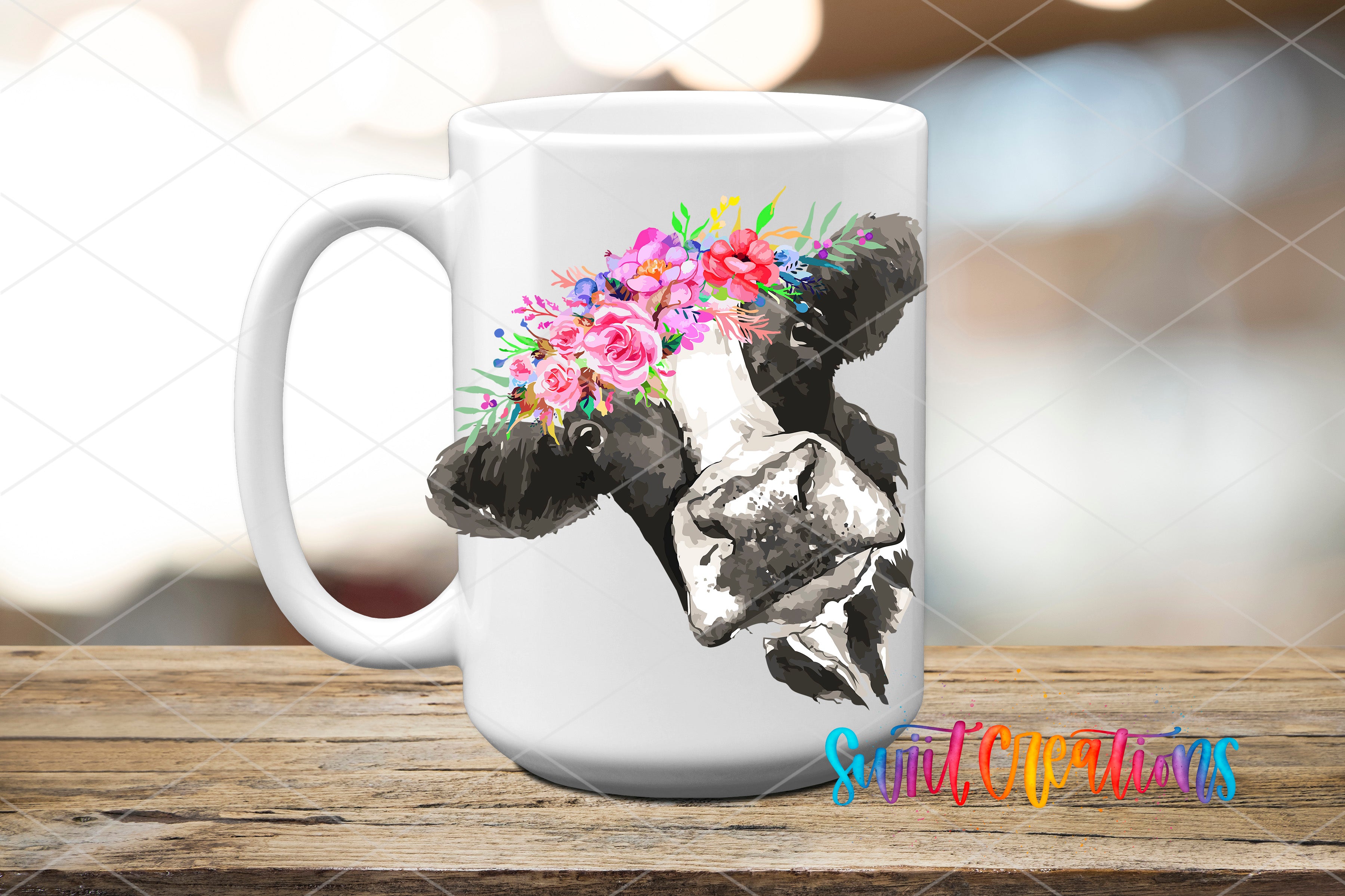 A white ceramic mug with a floral design on it, placed on a wooden surface.