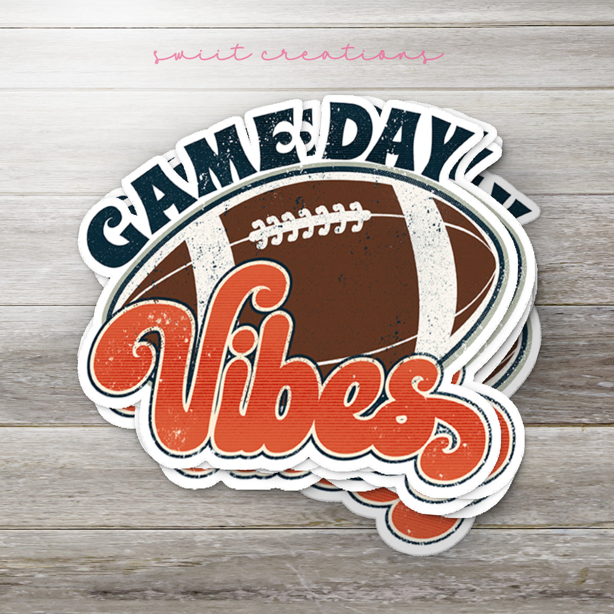 Stack of Football Game Day Vibes glossy stickers on a gray wood table