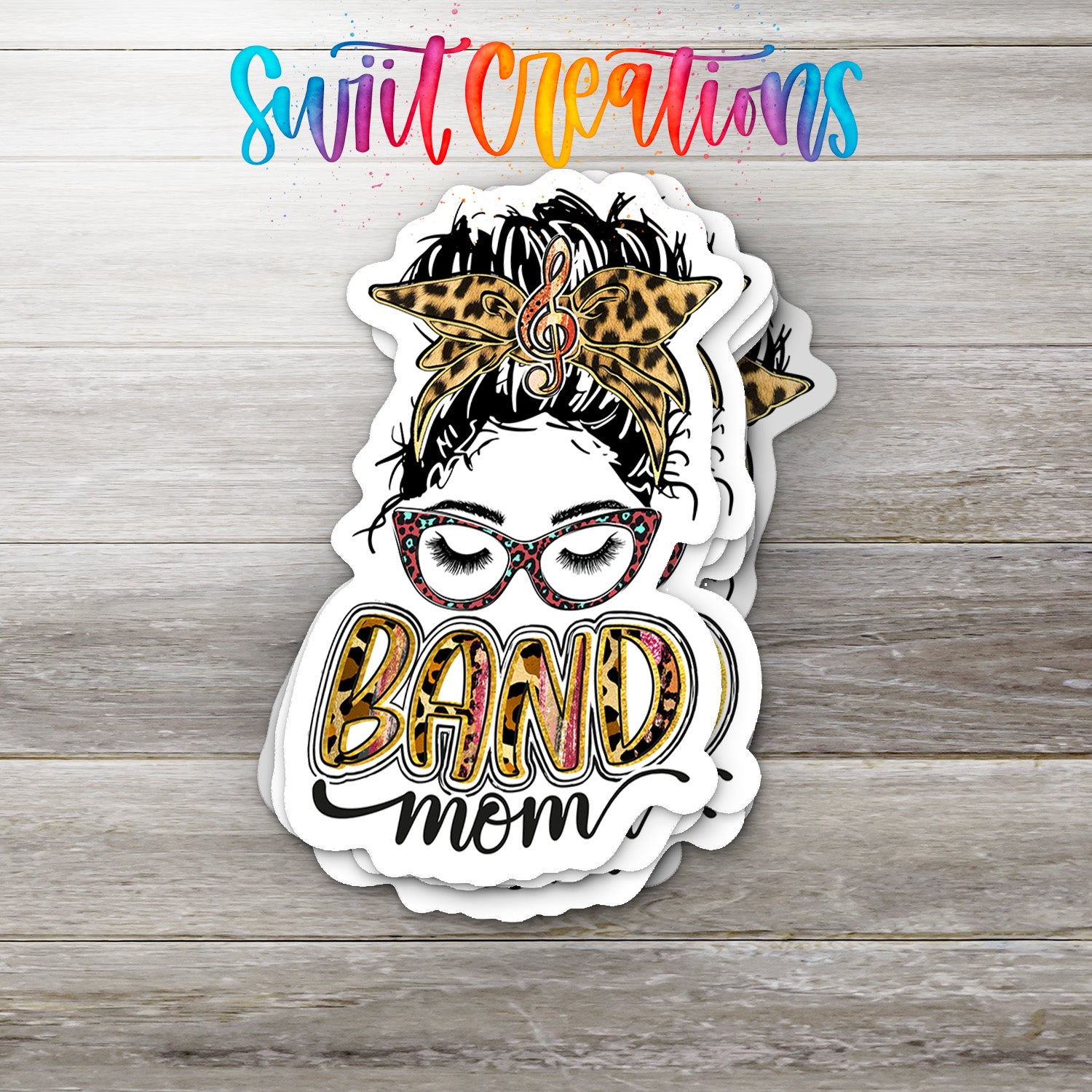 Stickers featuring a stylized illustration of a woman's face with a leopard print headband and the text "BAND mom"