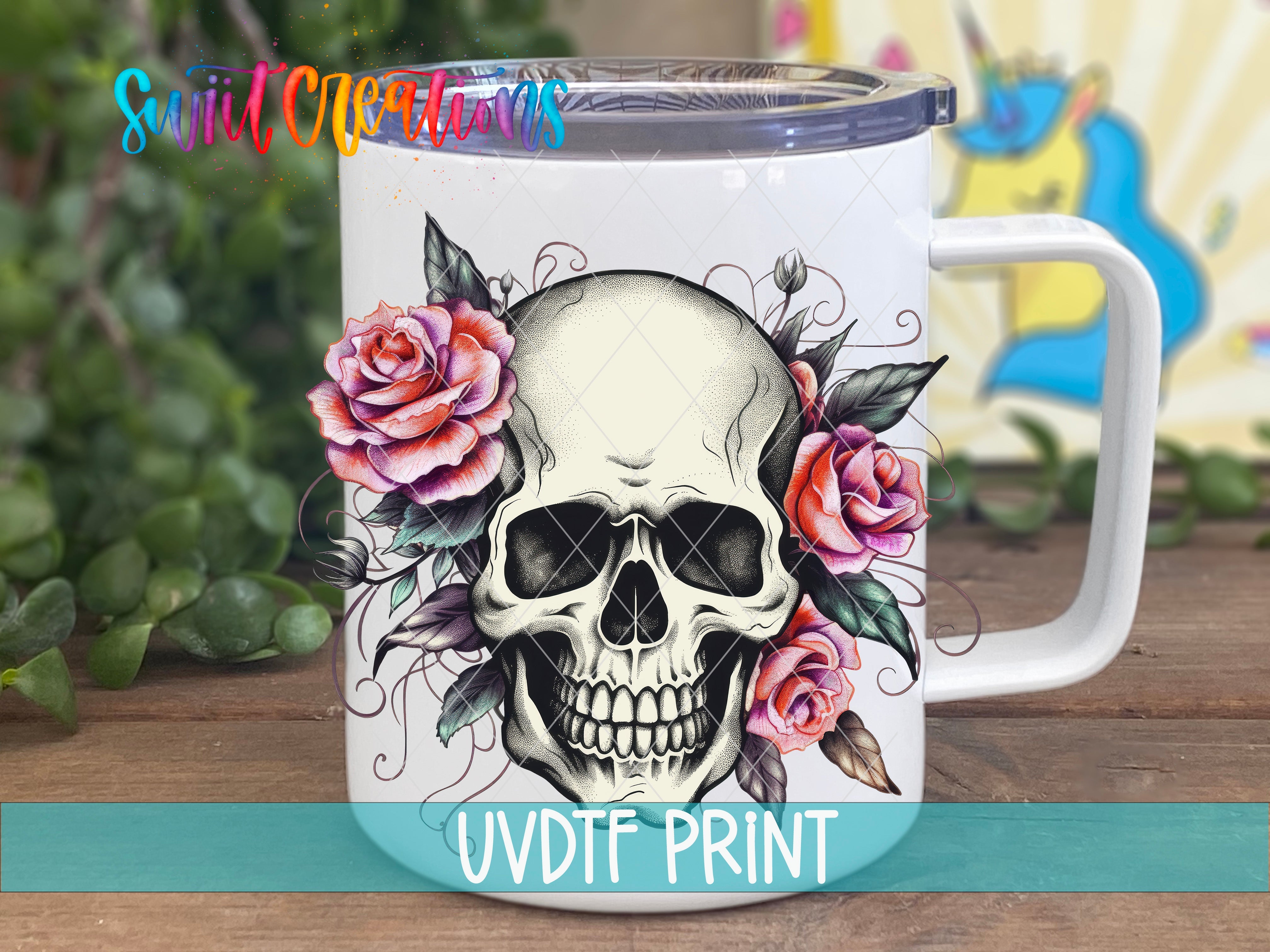 a white coffee mug with a skull and roses on it