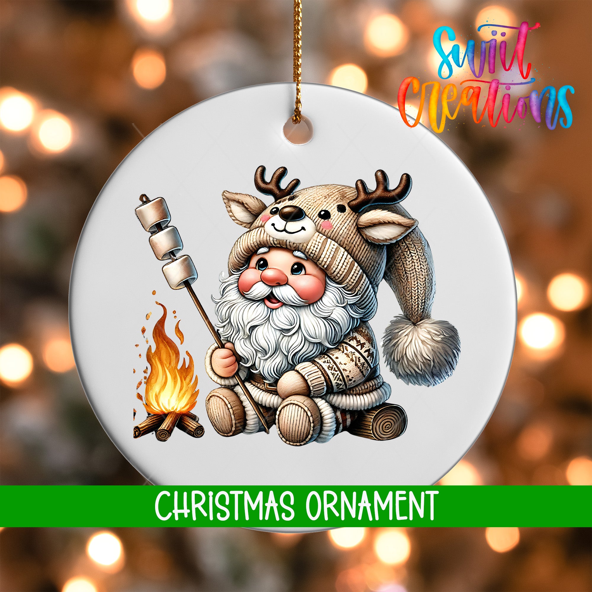 A Christmas ornament featuring a Santa Claus figure with antlers, holding a marshmallow over a campfire, with a background of blurred lights.