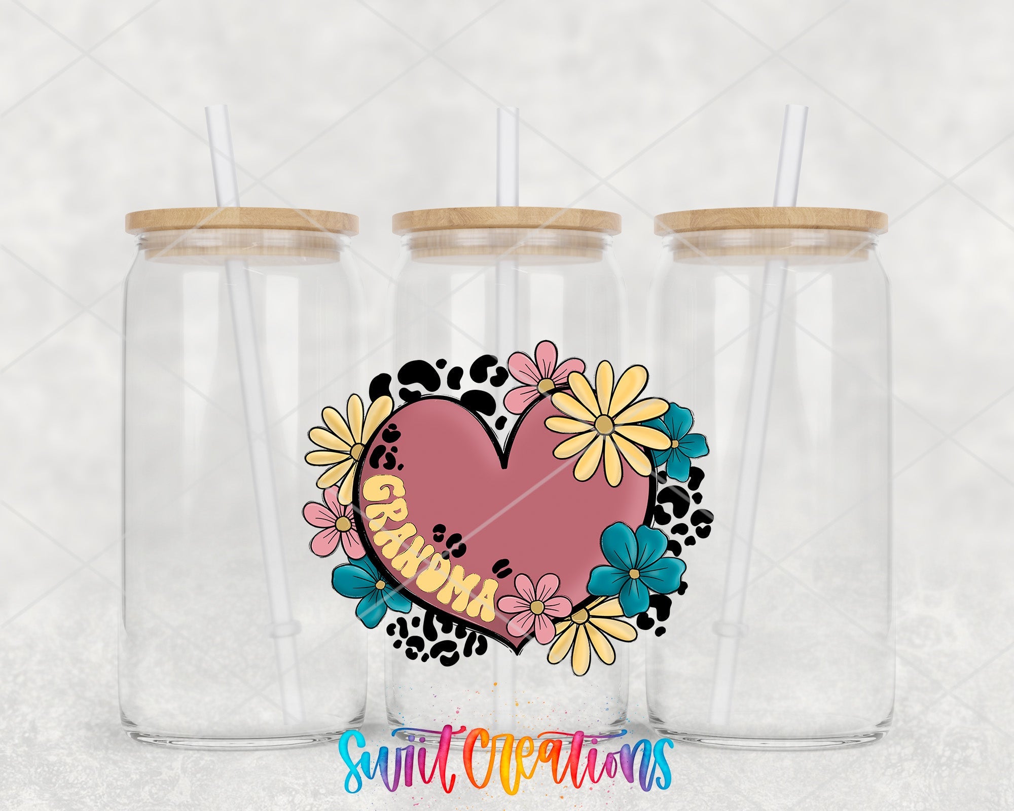 two clear tumblers with a heart and flowers on them