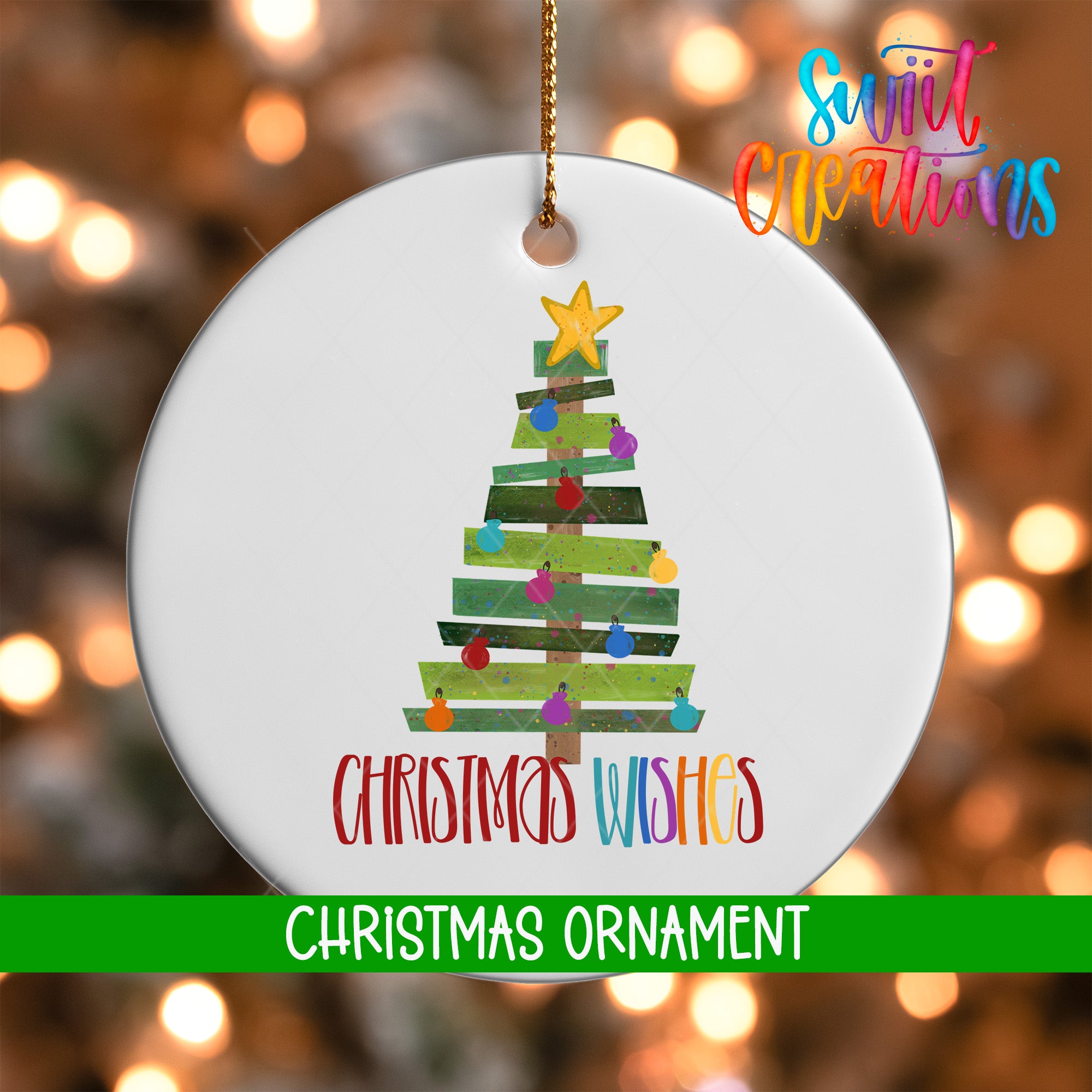 A white Christmas ornament with a colorful tree design and the text "Christmas Wishes" written on it.