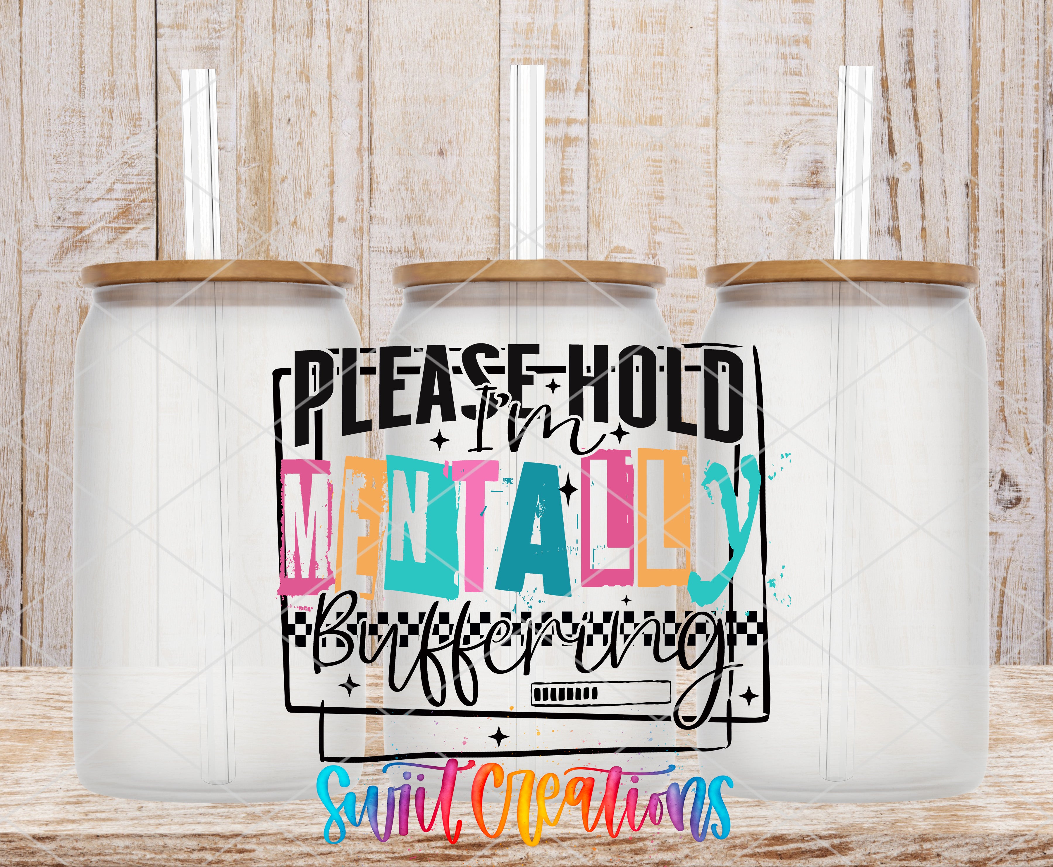three clear glass jars with wooden lids, each with a straw sticking out of the top. The jars are arranged in a row, and there is a colorful graphic design on the front of each jar that reads "PLEASE HOLD MENTALLY Buffet" in a playful, artistic font.
