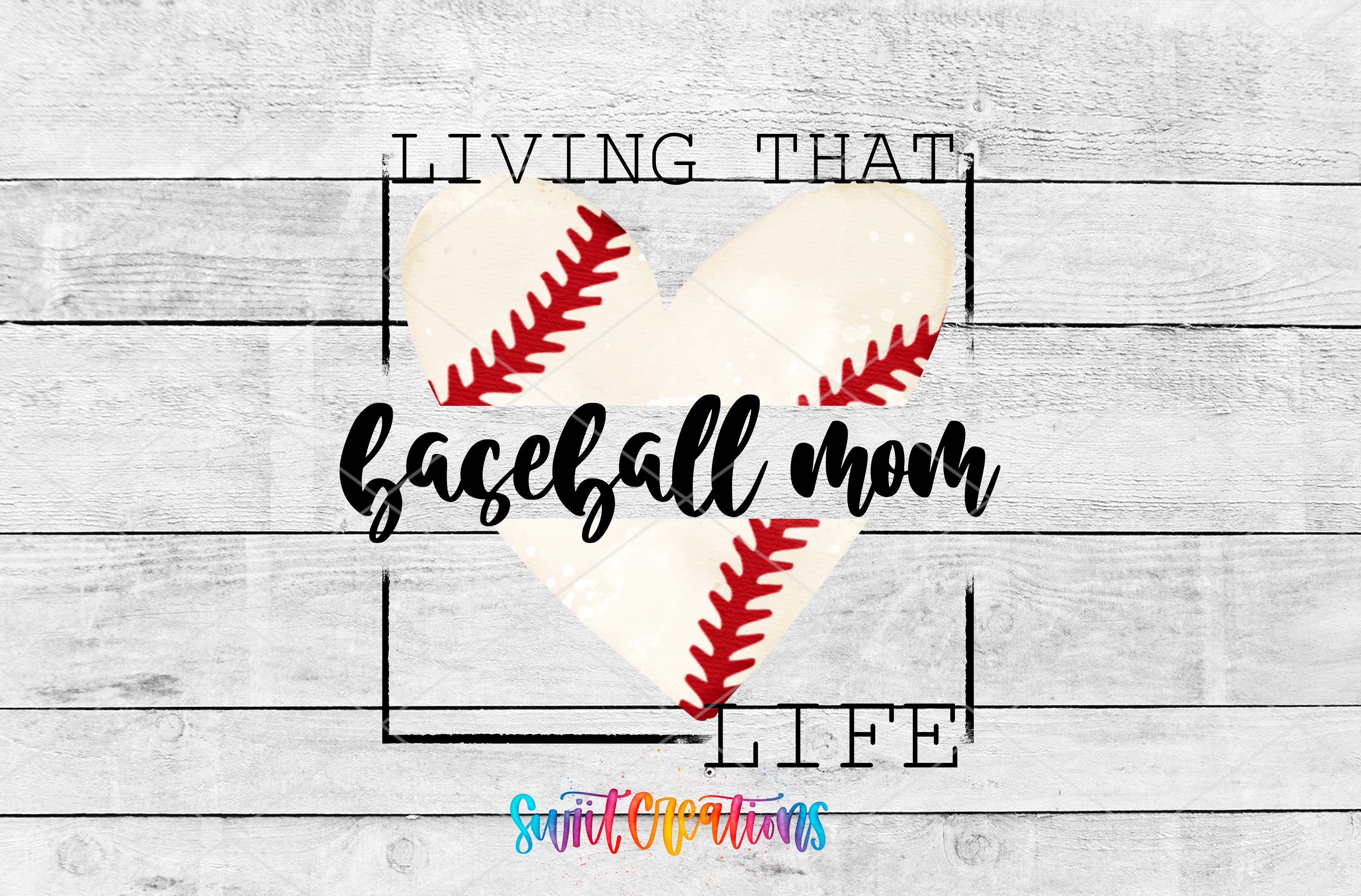 a heart-shaped baseball with the text "LIVING THAT BASEBALL MOM LIFE" written on it, set against a white wooden background.