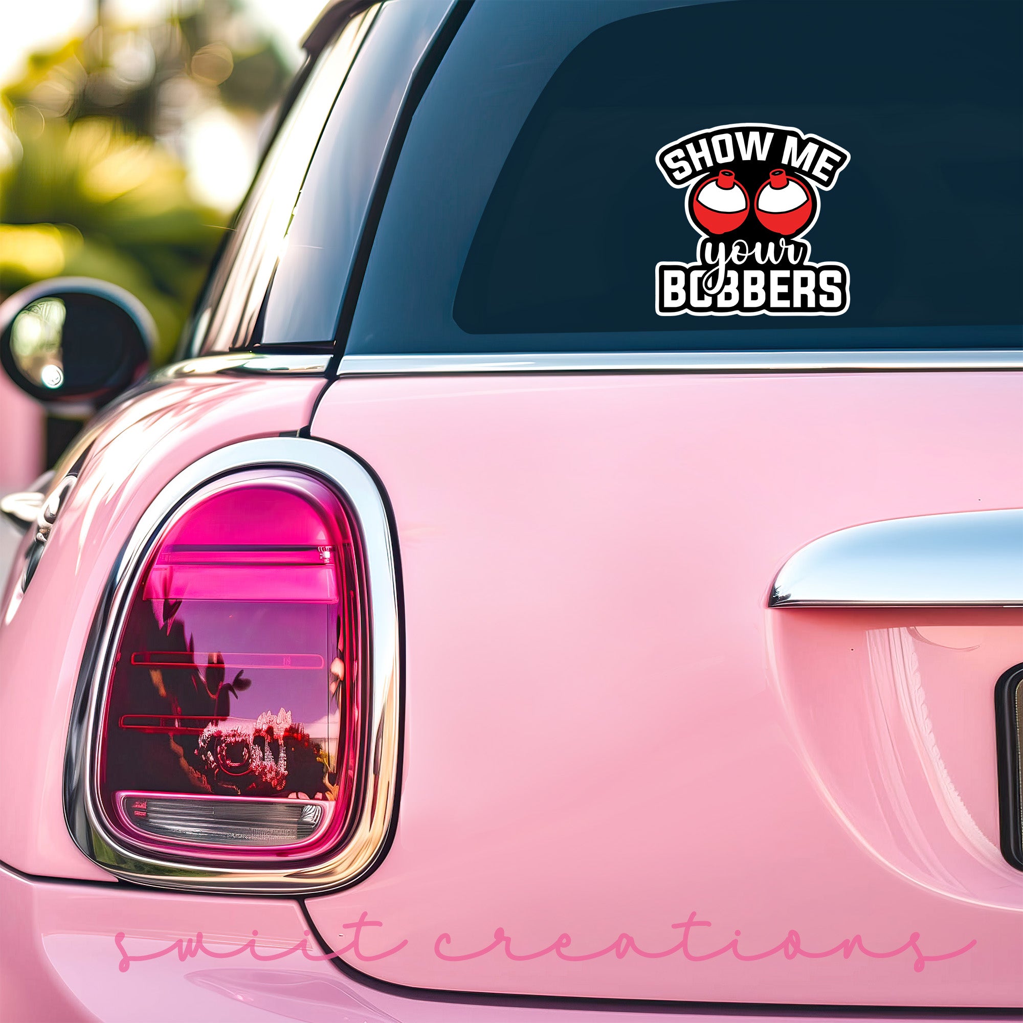 a pink car with a sticker that says show me bobbers