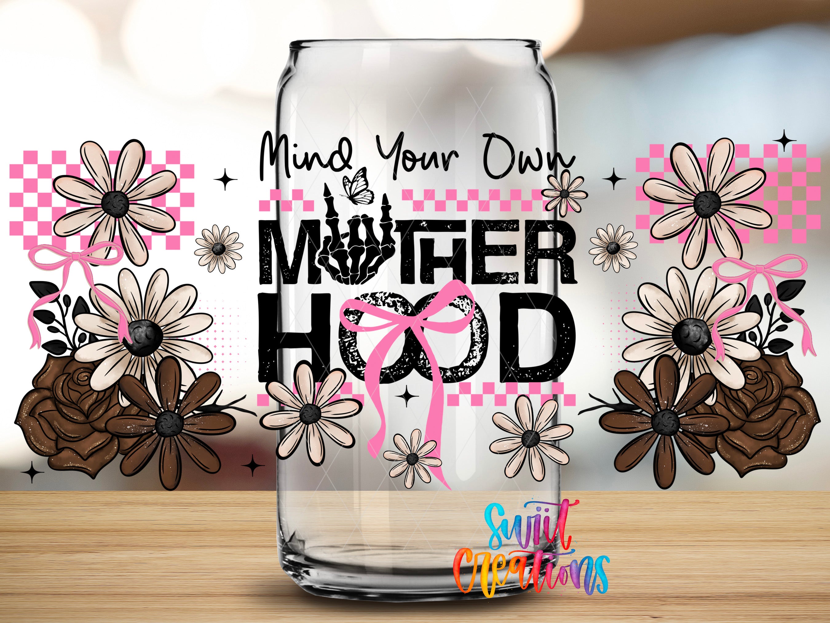 a glass can with a floral design and text that reads "MOTHER HOOD".
