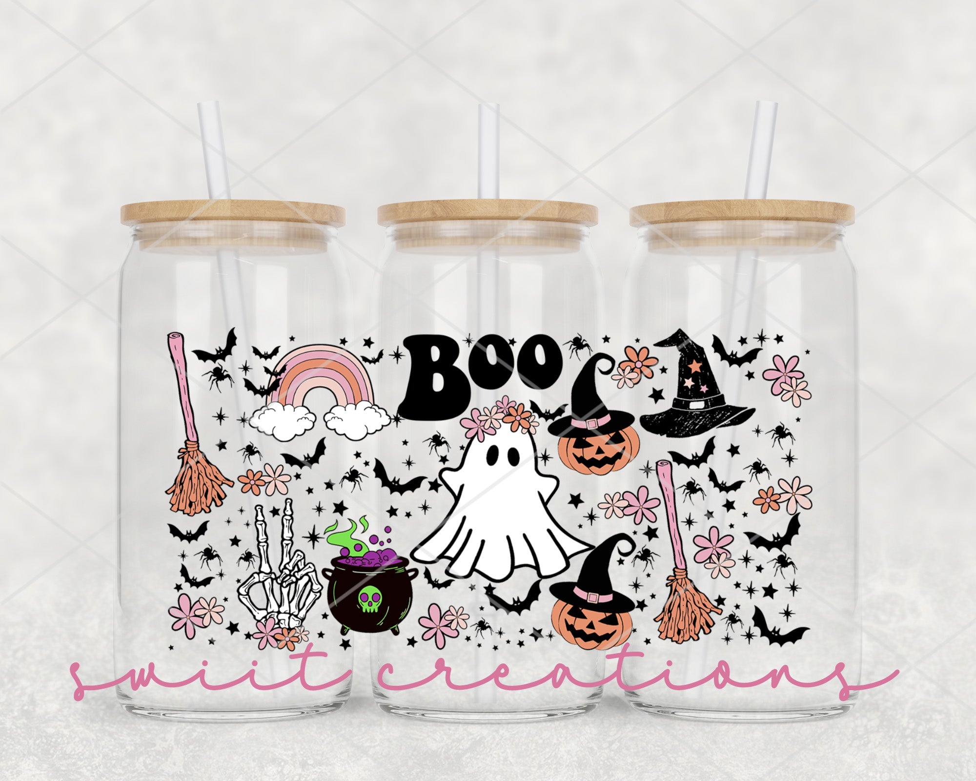 a couple of glass jars with halloween stickers on them
