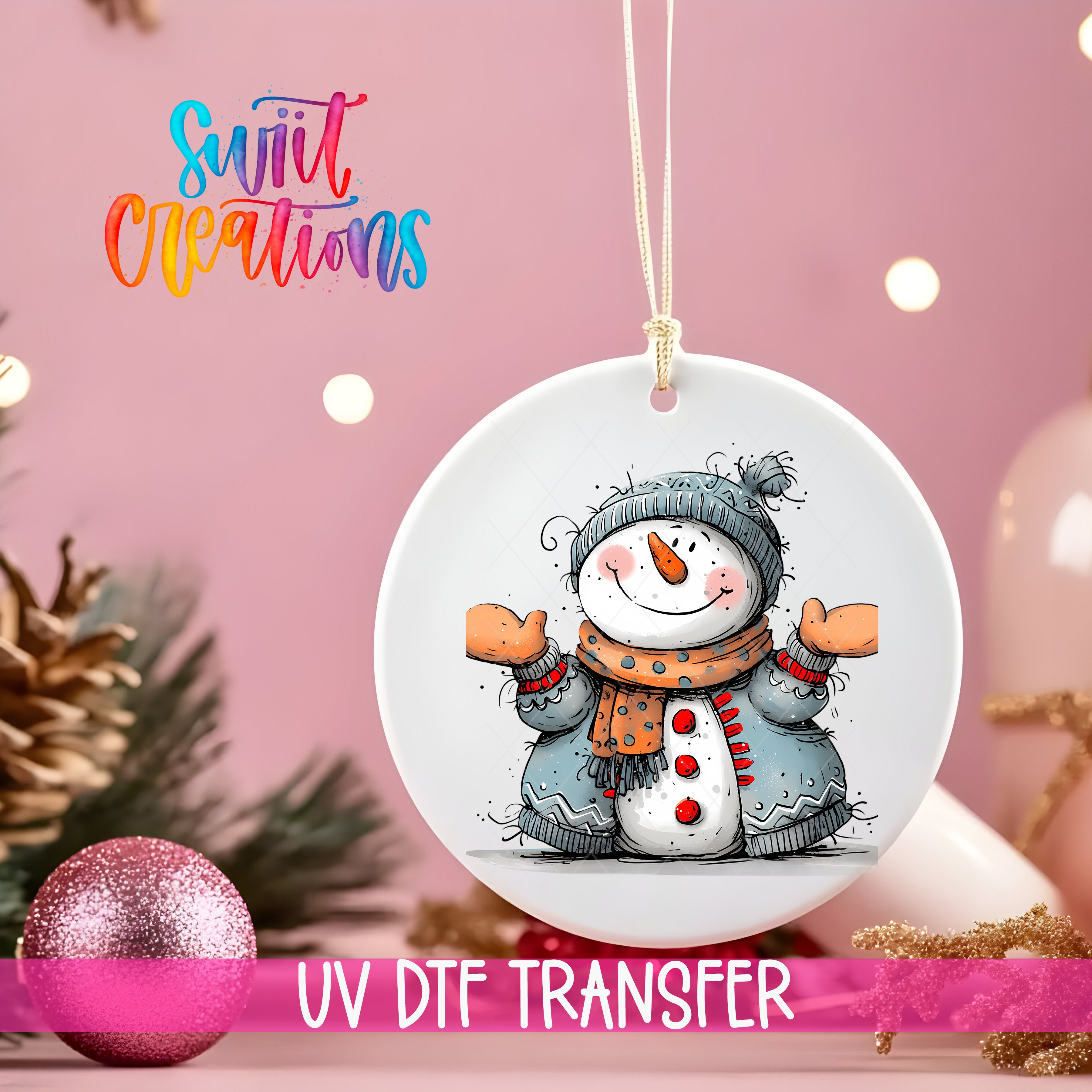 A white ornament with a snowman design hangs against a pink background, with a pink glitter ball and Christmas tree decorations visible in the background.