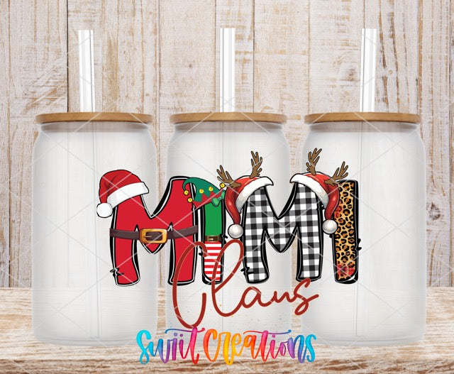 a couple of christmas mugs sitting on top of a wooden table