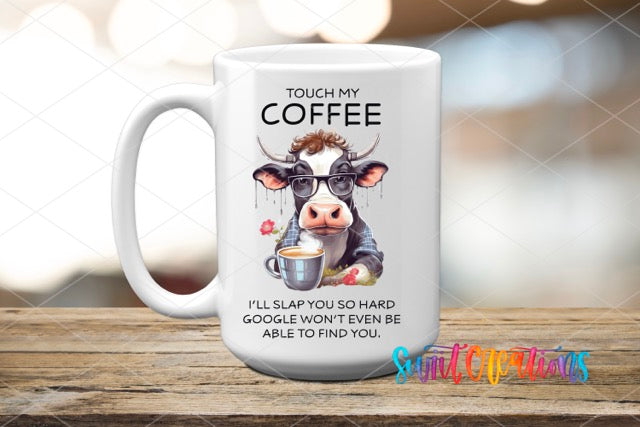 a coffee mug with a picture of a cow holding a cup of coffee