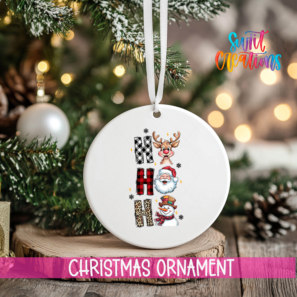 A white Christmas ornament with the word "HAPPY" spelled out in a decorative font, surrounded by various holiday-themed elements such as reindeer, snowmen, and pine cones.