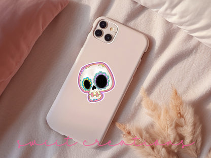 Pastel Sugar Skull sticker on a pink phone case