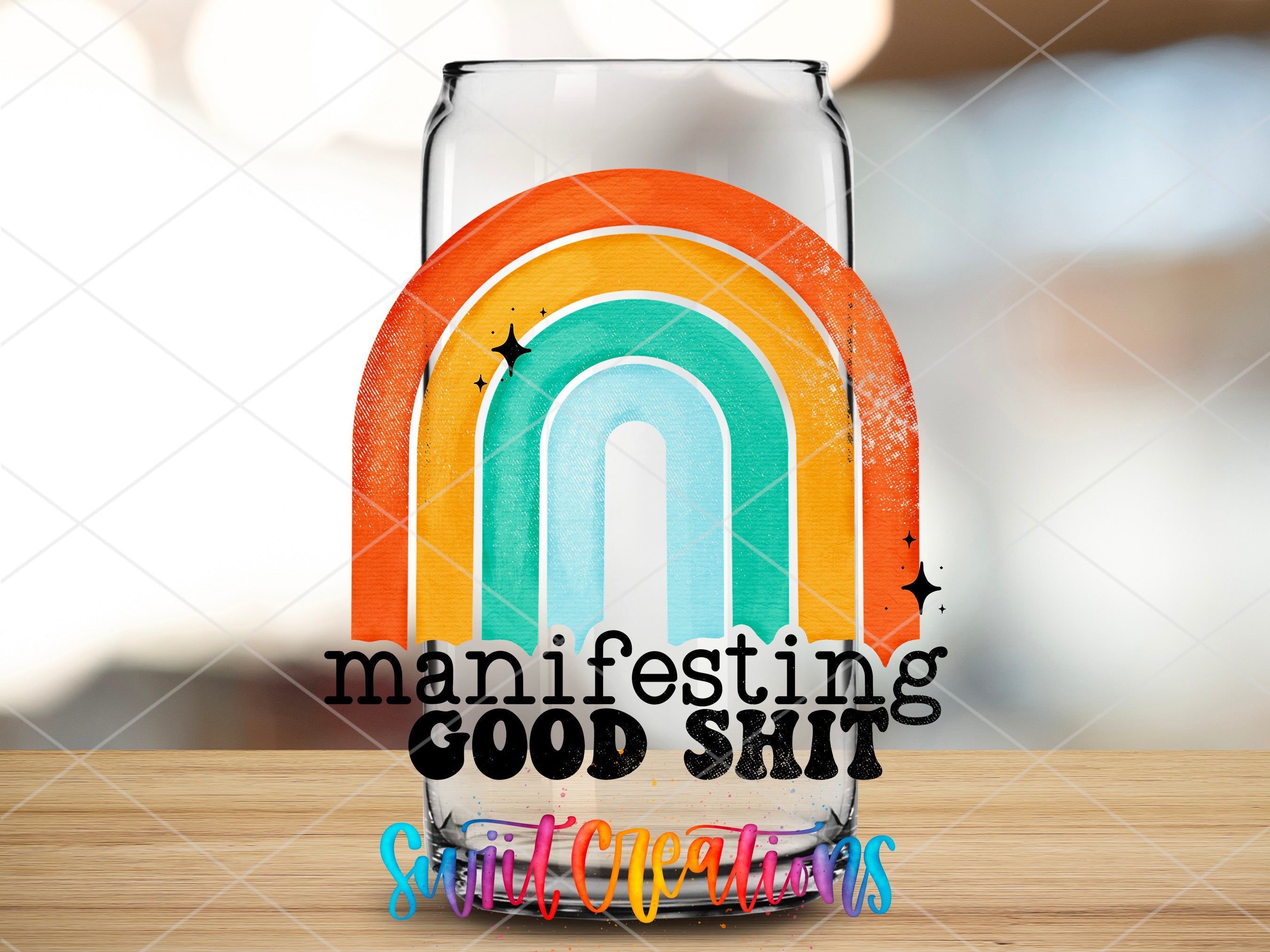 a beer glass with a rainbow painted on it