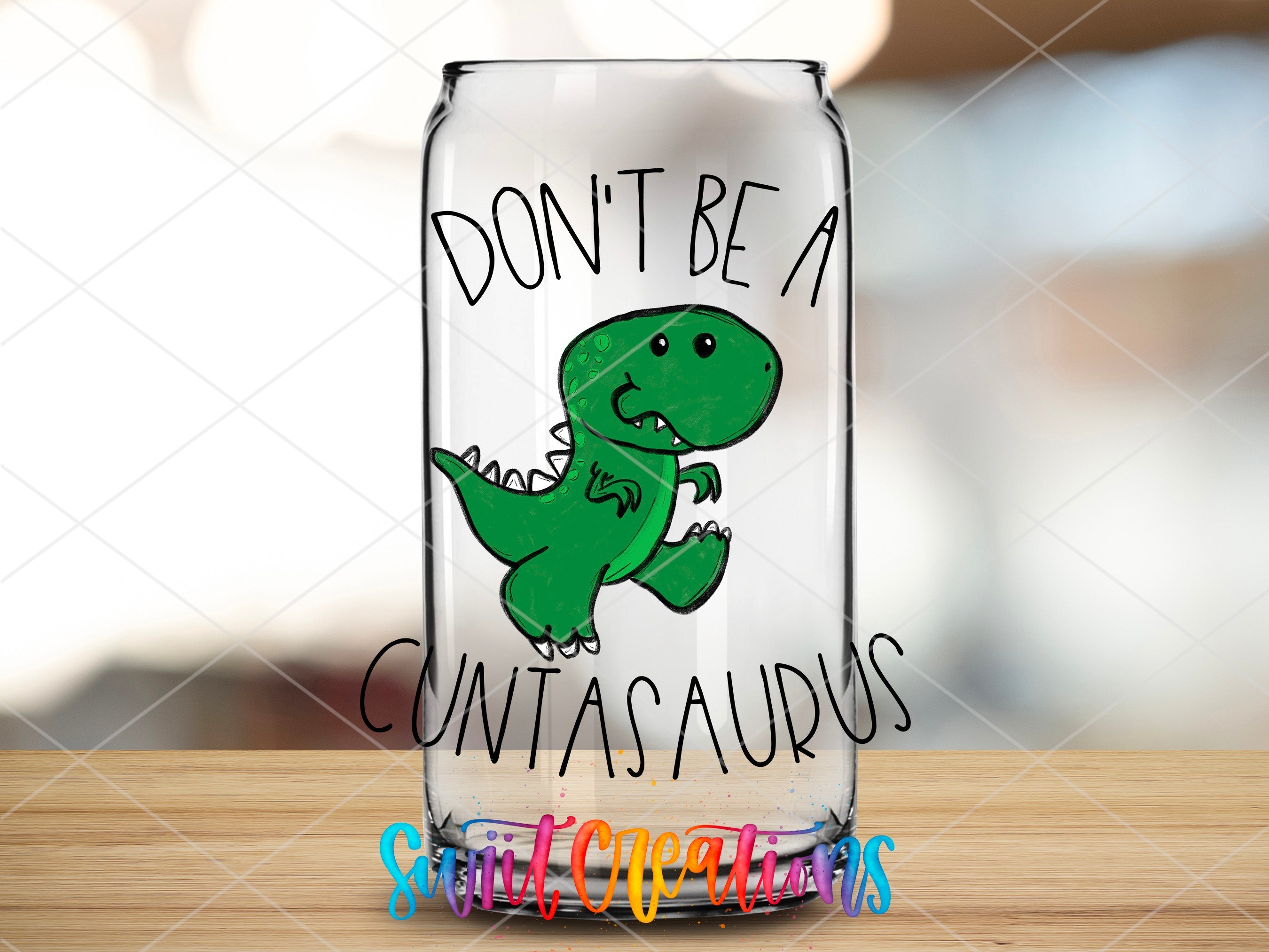 a glass jar with a picture of a dinosaur on it
