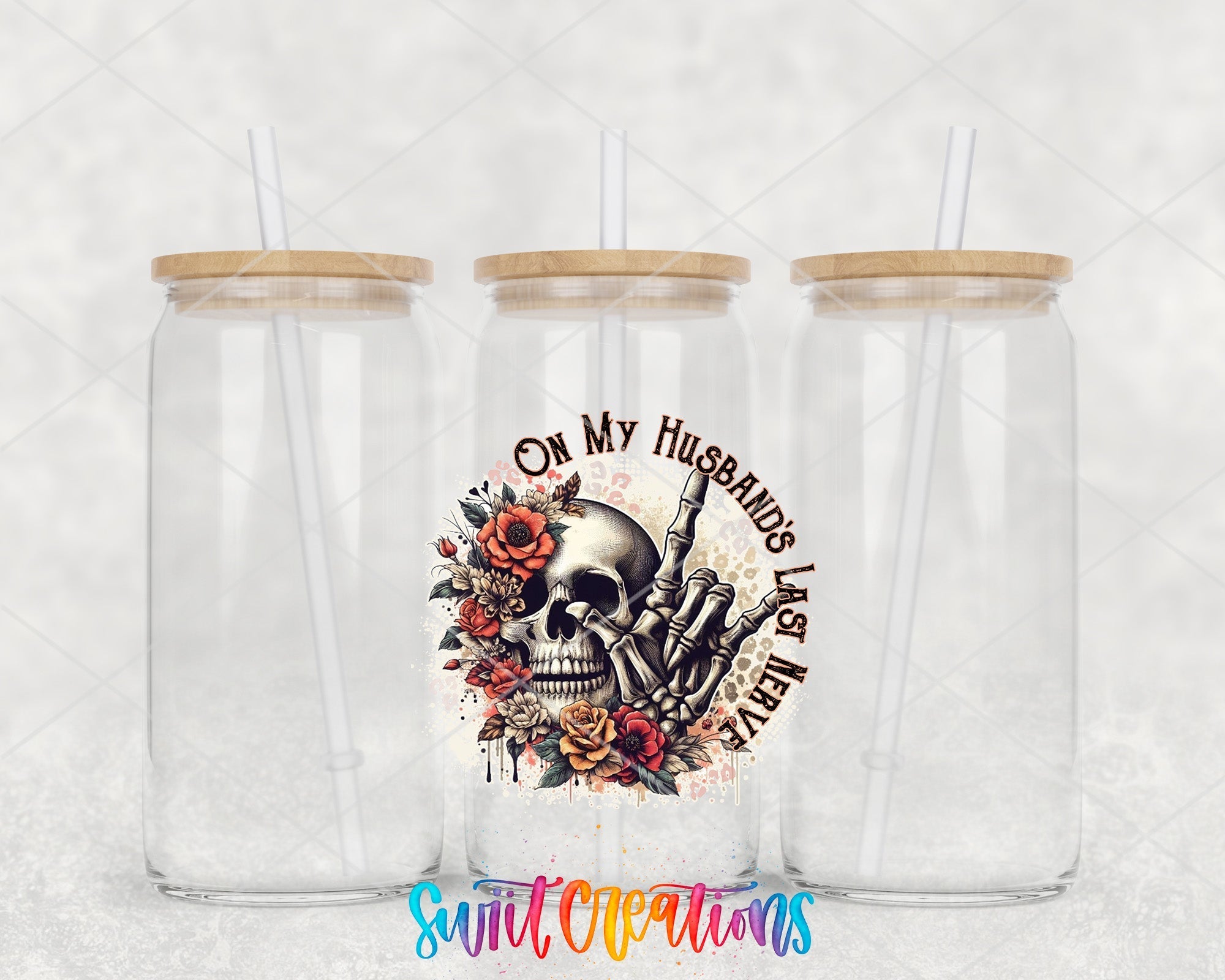 two clear tumblers with a skull and flowers on them