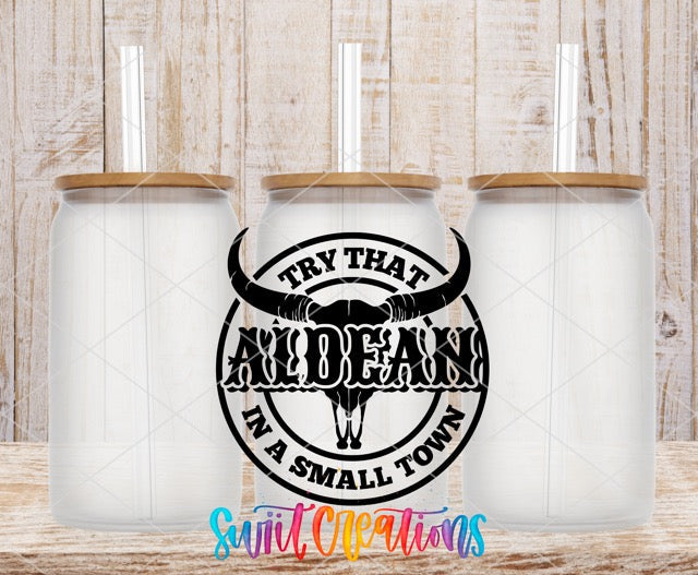 two white mugs with black lettering and a bull's head on them