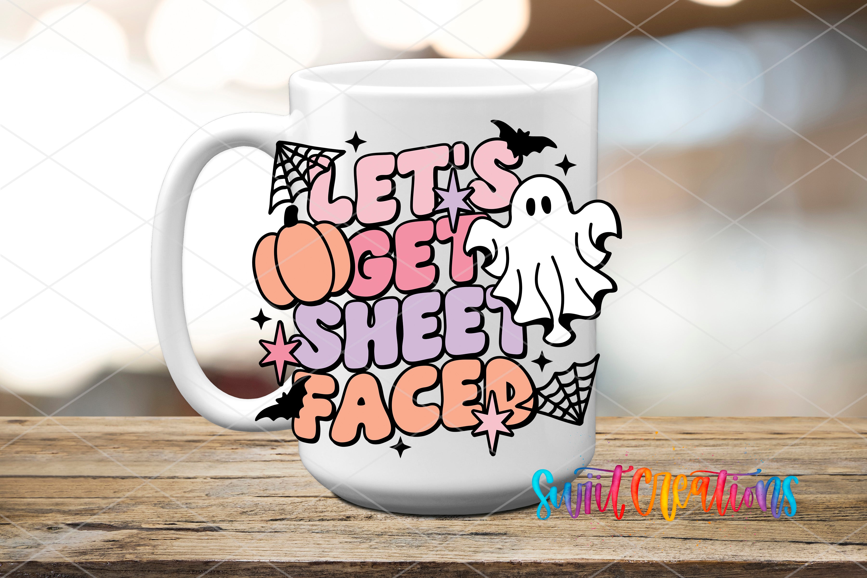 A white mug with a Halloween-themed design featuring a ghost, spider web, and text that says "Let's get sheet faced".