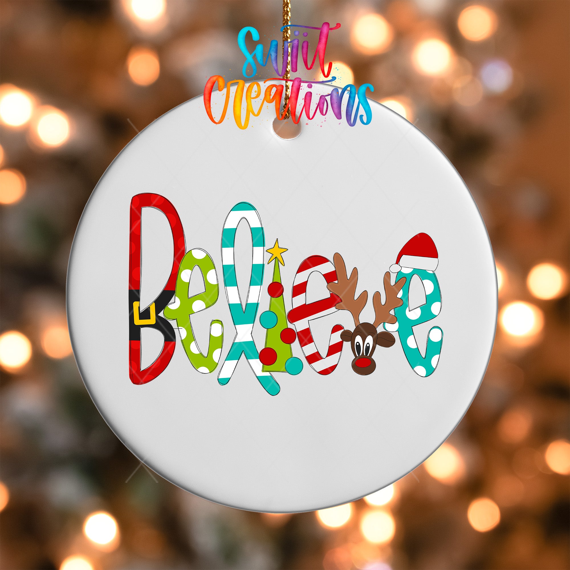 A white ornament with the word "Believe" written on it, featuring colorful letters and a reindeer.