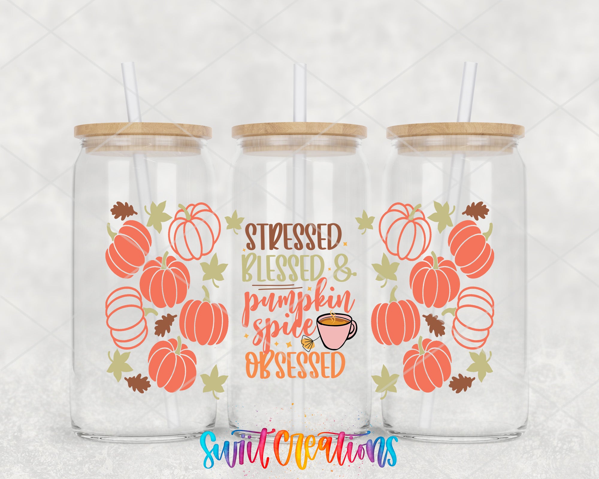three glass tumblers with pumpkin and leaf designs, each with a straw lid. The text on the tumblers reads "Stressed. Blessed & pumpkin spice Obsessed", which appears to be a humorous take on the fall season.