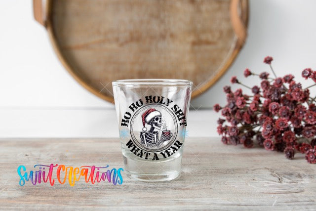 a shot glass sitting on top of a wooden table