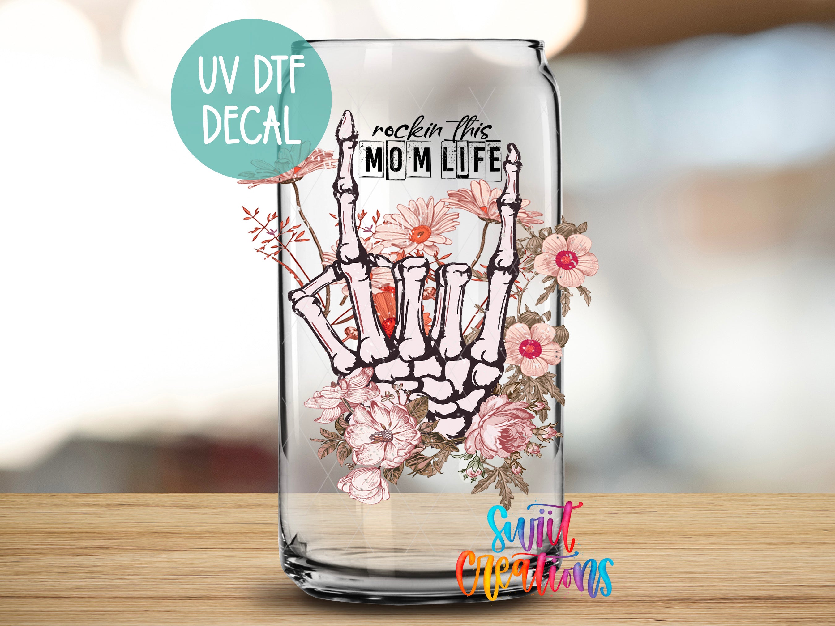 a glass vase with a picture of a hand holding a carrot