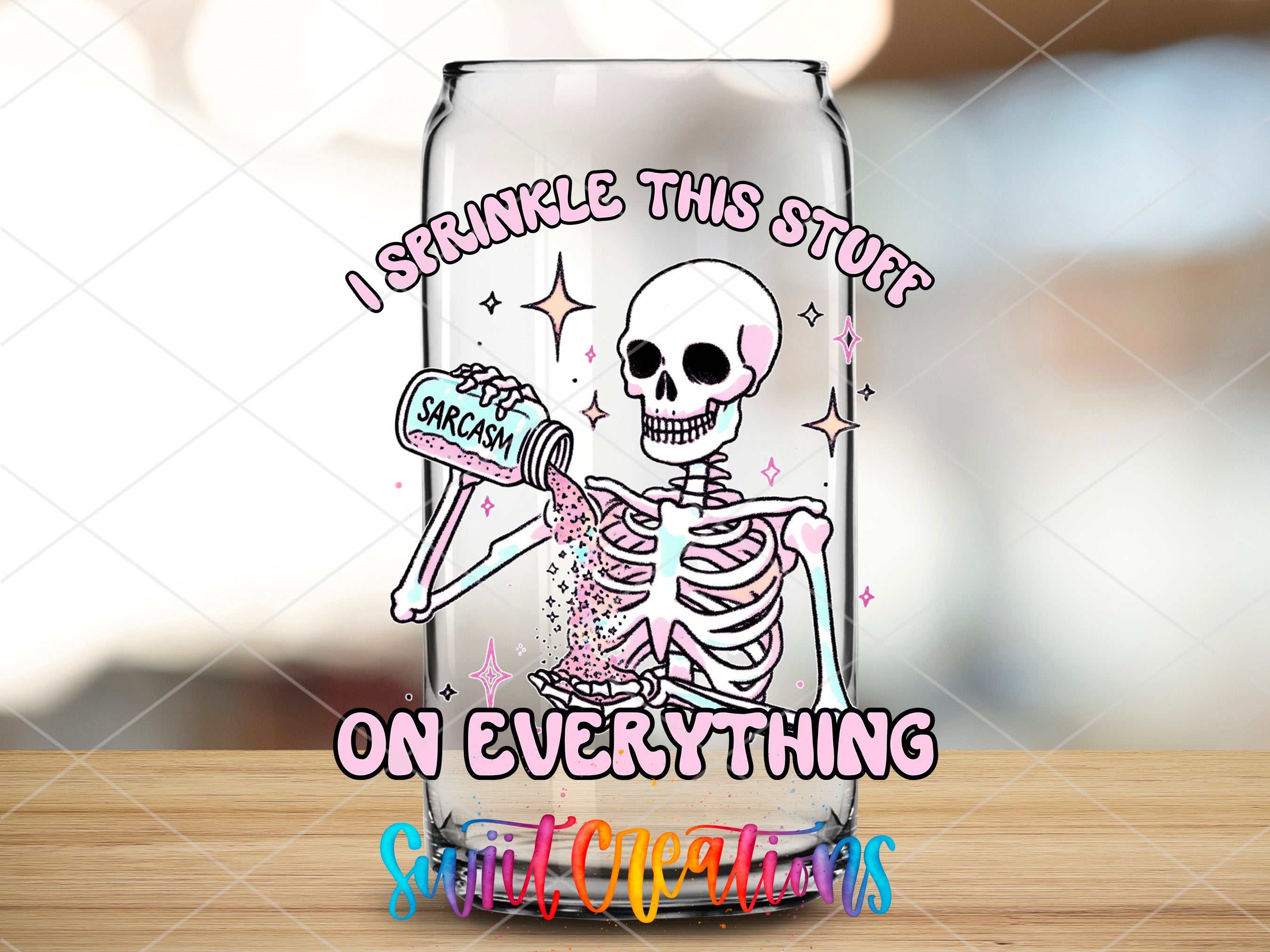 a glass jar with a skeleton in it