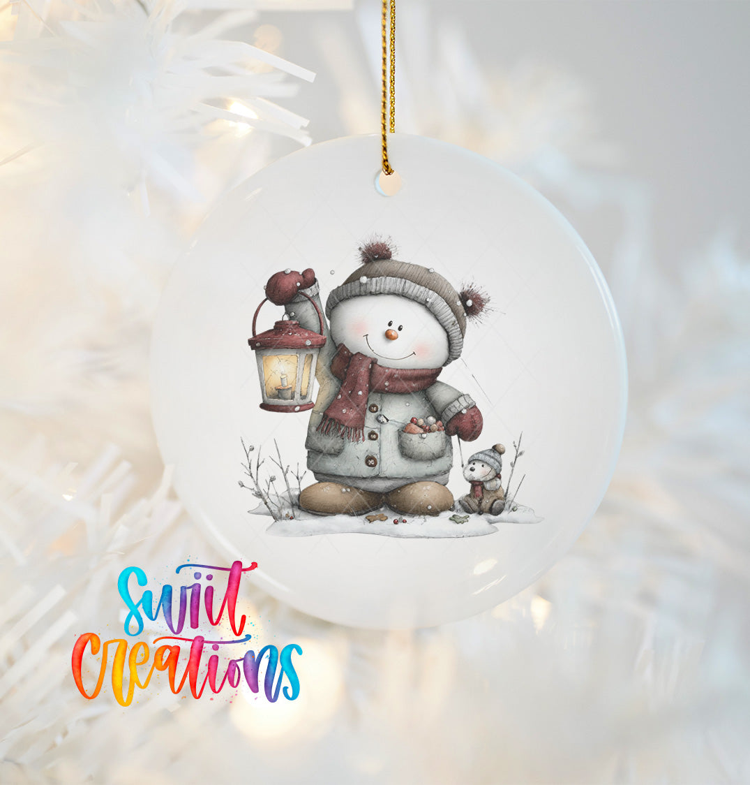A snowman ornament with a lantern and a small animal companion, set against a snowy background.